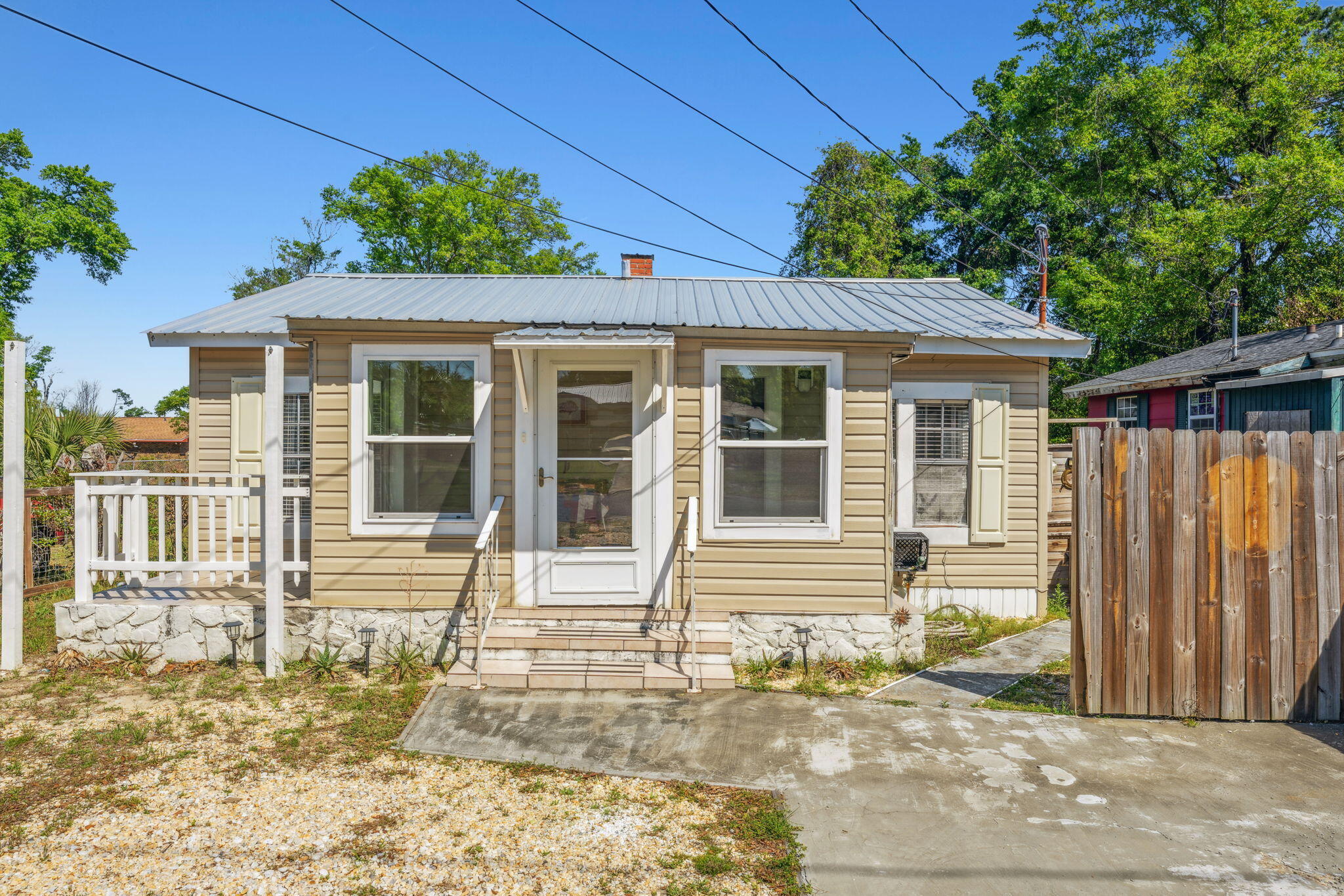 FHA and VA loan offers are welcome! Cozy Florida cottage nestled in the heart of St. Andrews. A short drive to Historic Downtown Panama City, St. Andrews Marina, and Panama City Beach. Close to shopping and some of the best restaurants in Bay County. This home comes fully furnished. Modern finishes throughout the home. Effective year built is 2010. Metal roof installed in 2019.  Enjoy relaxing Florida nights on the new deck overlooking the stylish firepit feature. Whether you are looking for a primary residence, a short- or long-term rental, or a seasonal home, this property is a must see!