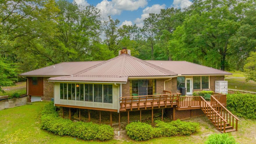 RARE 251 ACRE FLORIDA HOMESTEAD -  One owner SPORTSMAN'S PARADISE featuring RIVER FRONTAGE (SHOAL RIVER) and a VARIETAL BOUNTY of HUNTABLE WILDLIFE ON PROPERTY. Main home approx 2195 SF heat&cooled (+basement +covered drive thru parking +entertainment decks). Two substantial accessory buildings include 40x60 barn and separate workshop (both w/power & water). Please view all professional photos which also include multiple aerials of the acreage. Located just outside Crestview, so convenience is an appealing factor as well. There are many established hunting and nature trails. Current homesite was selected for its huge oak shade trees and improved with beautiful mature landscaping. Many family memories to be made in this home, designed for entertaining and functional living space. MAKE APPT!