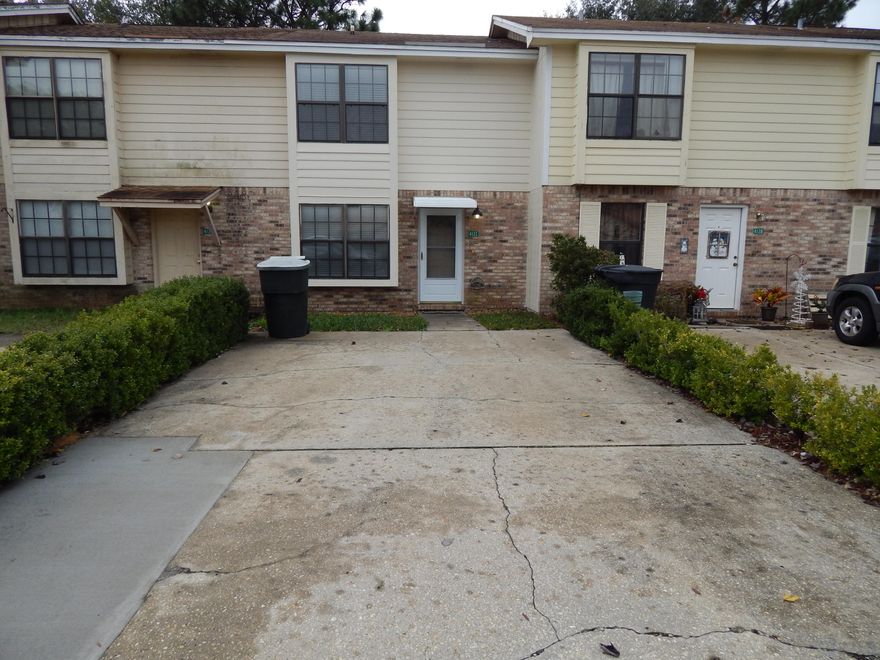 This clean and move-in ready townhouse has been well maintained by the Owner. Fresh paint and new carpet throughout!No home owners association fees on this low maintenance Brick and Wood townhome. Large Laundry room is inside and also serves as Pantry Space. Small, Privacy Fenced backyard. Newer Roof and HVAC - Approx 2011. Large Living Room, Dining, Kitchen, and Half Bath downstairs. 2 Bedrooms adn Full Bath Upstairs. One Bedroom has a large Walk-in Closet! There are FOUR Dedicated Parking Spaces! Centrally located, this 2 story unit is close to Santa Rosa Mall, Grocery stores, Fort Walton High School and Edwins Elementary School.