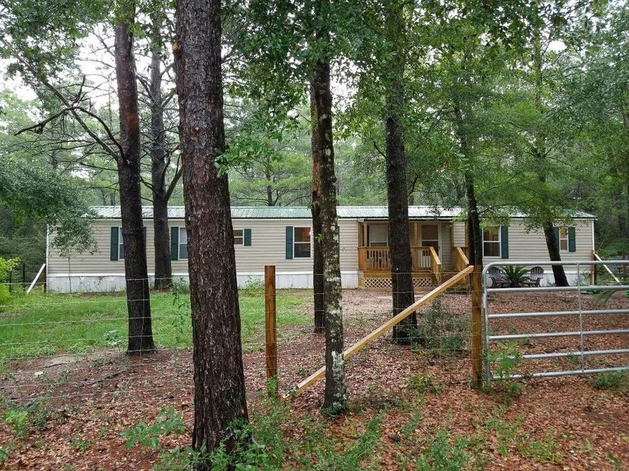 Single wide mobile home 16x76' new laminated floors, new metal roof, freshly repainted interior and newly new fenced front yard on nearly 1 acre (.96)This home is ready to move into. The seller is leaving the shed, microwave, stove, refrigerator, and misc. furniture. Tv's not included.