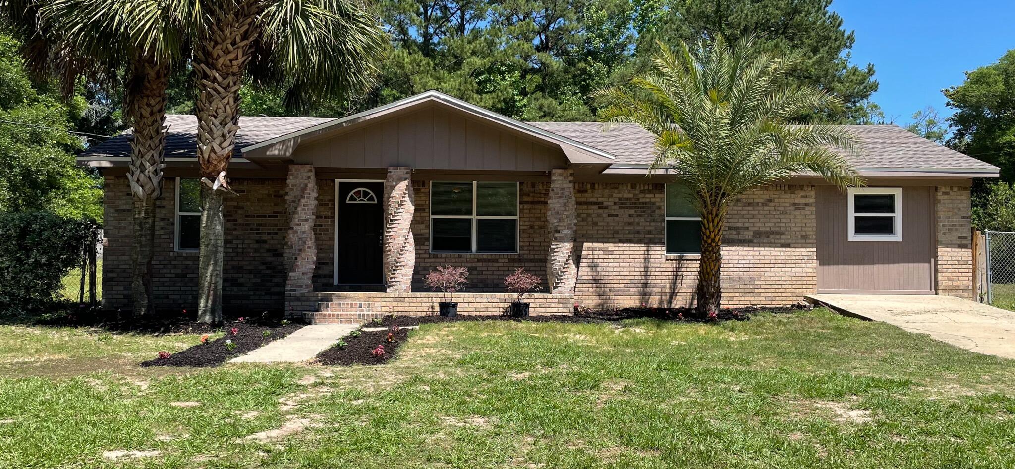 Feels like a brand new home ''turn key ready''.  Seller has updated the home completely. Now a 4 bedrooms, 2 bath home with a new kitchen, bathrooms, paint, floor covering, roof, landscaping and more.  It is almost across from the Ponce de Leon High School.  45-50 minutes to South Walton Beaches, and appx. 1 hour to Panama City Beaches. .