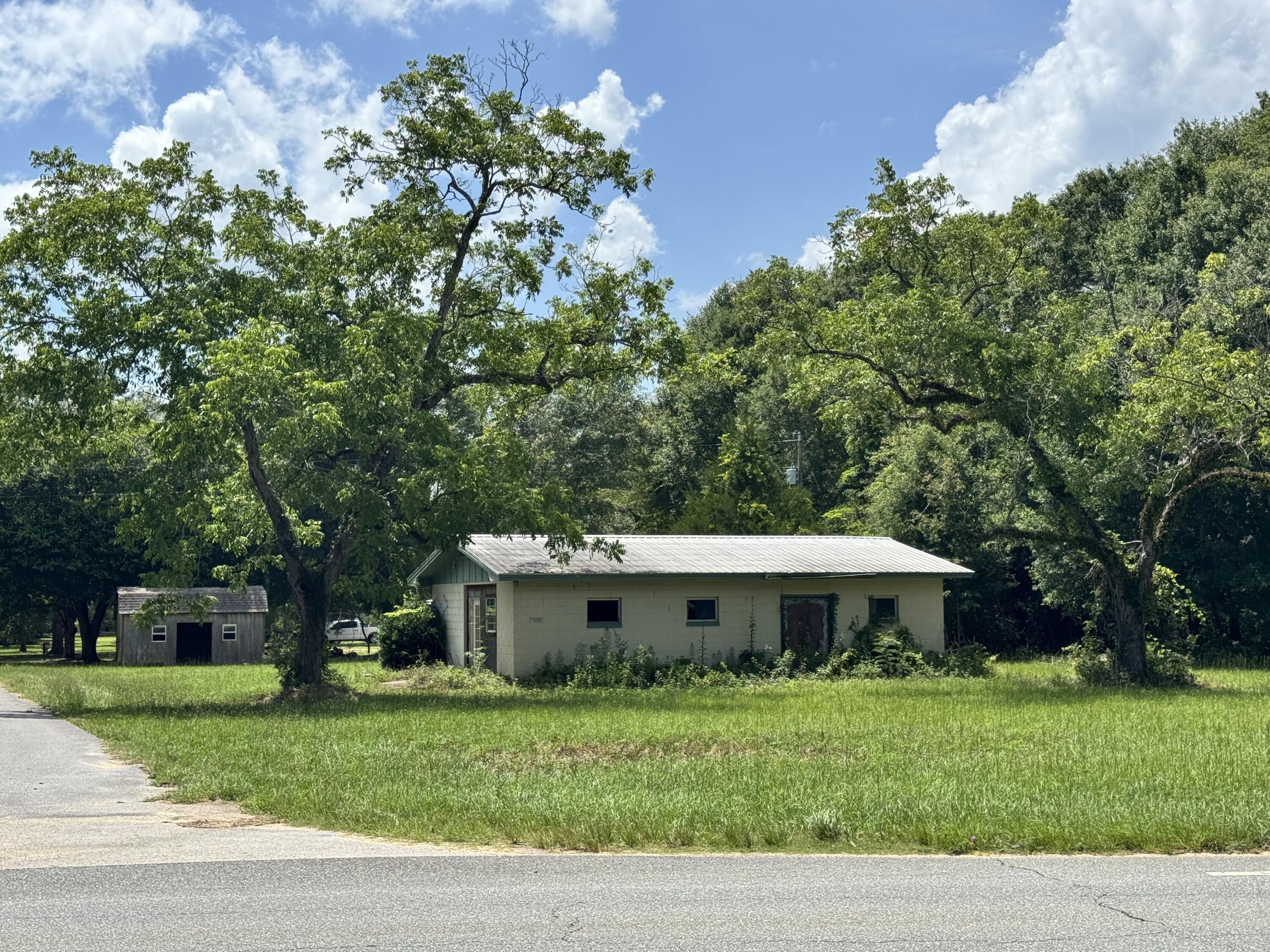 Home & land on Hwy. 85 with potential commercial space conveniently located between Crestview and Laurel Hill on a corner lot with over 140' frontage on Hwy. 85 North! Seller will entertain OWNER FINANCING with acceptable terms!
