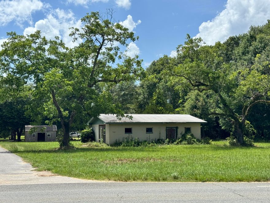 Home & land on Hwy. 85 with potential commercial space conveniently located between Crestview and Laurel Hill on a corner lot with over 140' frontage on Hwy. 85 North! Seller will entertain OWNER FINANCING with acceptable terms!