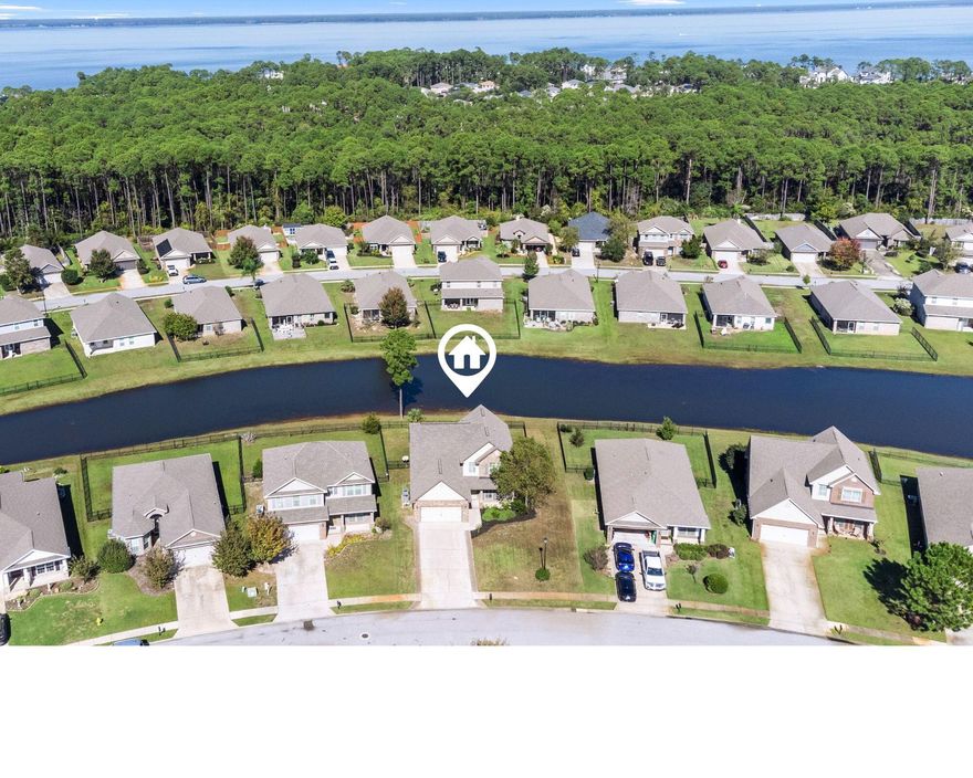 ***SELLERS OFFERING $10,000 in ANY WAY MONEY TO THE BUYERS!!!!!! ***  Nestled in the picturesque community of  Driftwood Estates, this charming 4-bedroom, 2.5 bathroom single-family home offers the perfect blend of comfort and style. This amazing property offers beautiful views and is situated on 70 feet on one of the seven ponds within the Driftwood Estates community. The home has been elegantly upgraded with beautiful white built-in shutters throughout from top to bottom! As you step into the home, you are greeted the spacious living room complete with hardwood floors, ceiling fan, and plenty of windows for lots of natural light. The living room is open to the home's large kitchen and dining area.  The kitchen is complete with wood cabinetry with under cabinet lighting that is wired into the electrical system, granite counters, stainless steel appliances, island with breakfast bar, pantry, and window overlooking the pond. The dining area is just off of the kitchen with a large window and plenty of room for a large table for dining. There is a first floor powder room just off of the kitchen and dining area for guests. The first floor master bedroom is adorned with crown molding and can easily accommodate a king bed. There is a double window in the master bedroom that overlooks the backyard and pond. The master bathroom has 20x20 inch tiles, granite double vanity, walk-in tile shower with glass enclosure, linen closet, water closet and large walk-in closet.
The second floor of the home offers a HUGE bonus room that could easily work as an additional bedroom, media room, pool table or more... Also on the second floor, are two additional bedrooms separated by a second full bathroom. The home's indoor laundry room is located just off of the hallway. The home's two garage has a fully finished floors and interior space complete with auto opener. The extra wide driveway has been tastefully extended with pavers for comfortable parking. The front of the home has a cover front porch overlooking the street. Relax in the sprawling backyard with newly installed black iron fence (perfect for pets) and open patio with arbor overlooking the the beautiful pond.
There are TWO brand new HVAC units installed in 2024 (upstairs and downstairs). The entire downstairs has also been freshly painted in 2024. Enjoy the perks of living in Driftwood Estates with a community pool, playground, park, tennis courts and more!
Close to Sacred Heart Hospital, Publix, Grand Boulevard, wonderful shopping and dining and just a short drive to the Emerald Coast beaches. Don't miss out on the opportunity to call this wonderful Santa Rosa Beach home yours, scheduling your showing TODAY!