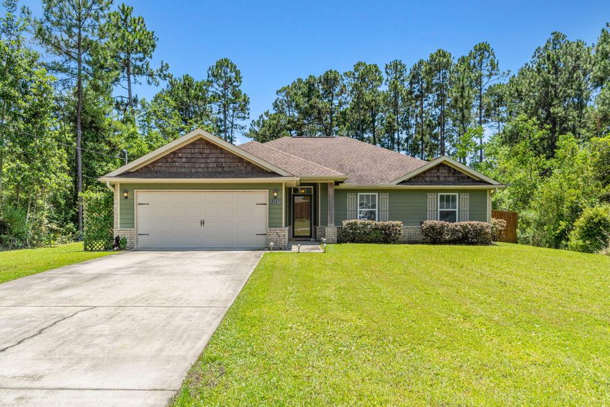 This 4/2/2 Solar Home features hardie board and brick siding is a must see! House has a decorative brick knee wall with dimensional shingle roof. The floor plan offers you ample of privacy. There are 10ft. ceilings in the family room and kitchen. Kitchen includes center island, self cleaning oven, smooth top range, built-in microwave, garbage disposal, stainless steel appliances, under mount sink, and premium raised panel cabinetry with beautiful granite countertops. Spacious master suite has fan and vaulted ceiling along with sitting area with a door that leads out to the enclosed porch. Master bath offers walk-in tiled shower large enough for two. Cultured marble countertops in baths. Large lot with sprinkler system and privacy fence, and best of all a complete solar system