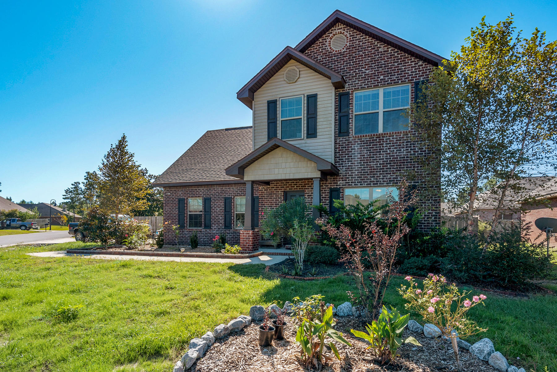 Beautiful brick home is located perfectly between Destin and Panama City! Home features 3 upstairs bedrooms, 2 1/2 baths, and 2 car garage. The kitchen is open to the large family. This large corner lot has a completely fenced in back yard with decking just waiting for a party! Great family neighborhood..come see for yourself today!