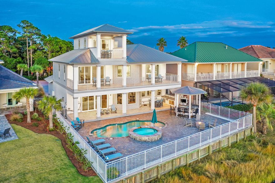 INVESTORS!!  Over $400,000 in projected GROSS rental income for 2022 w $180,000 pre-booked. Talk about a gorgeous view...ONE OF THE BEST IN DESTIN!!   Home is located on one of the most premier lots in Destiny East with panoramic views of the lake and gulf.  If you are searching for a primary/secondary home or investment rental, Sundancer has it all with outstanding community amenities and location. Charm abounds inside with custom finishes, open kitchen, expansive living areas and six bedrooms including bunks. Golf cart included.