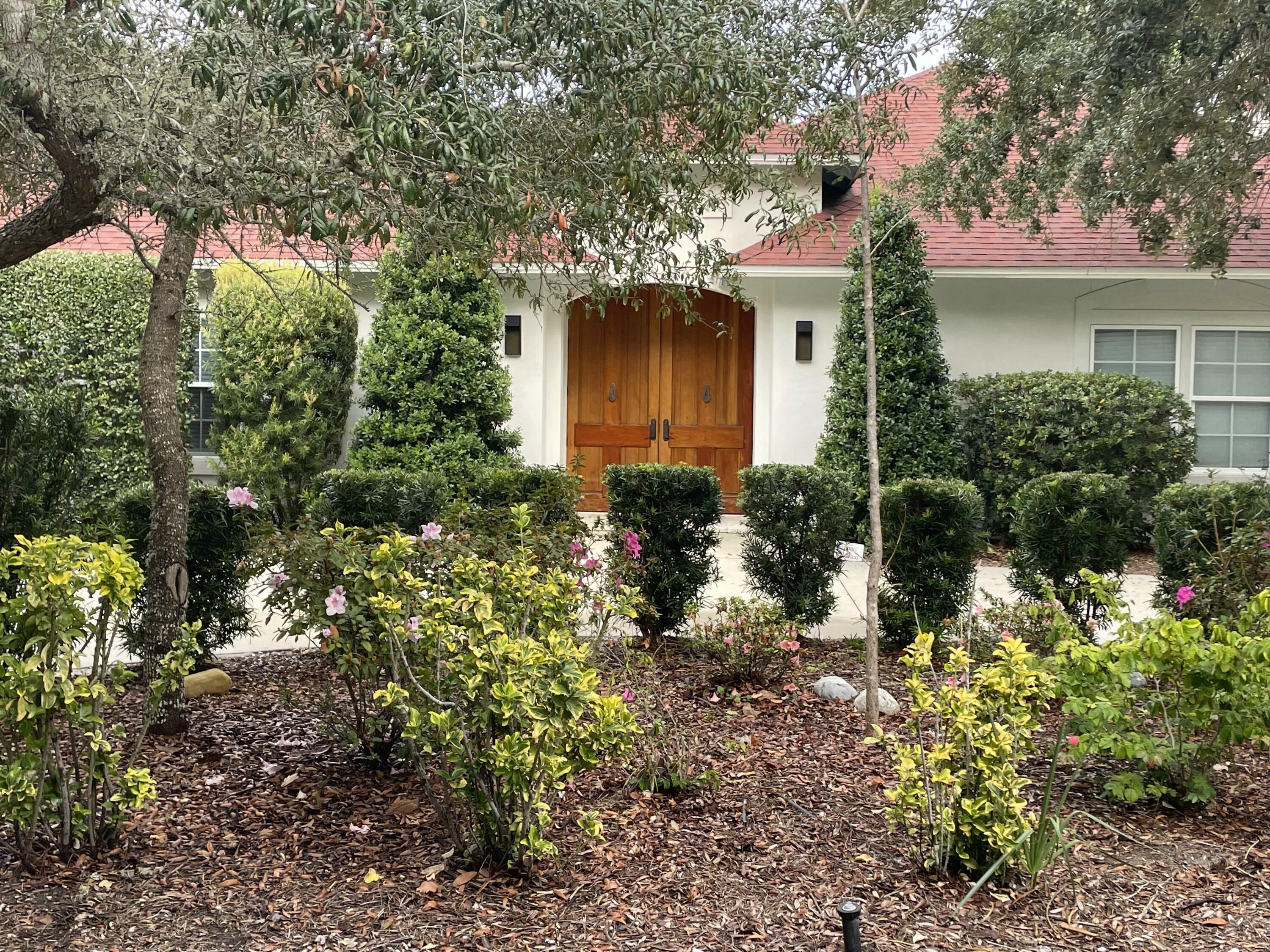 Ultra-private drive secluded off desirable 30A. Find a manicured landscape with scrub oaks and bush walls that protect this homesite. This Mediterranean home boasts large wood doors into an open entry way. There is currently a private 1/1 with full kitchen and bath used on rental management program 25k income for 2021. Rental projections for main house 3/3 are 100-115k, there is currently no HOA.Large window doors, exercise spa-pool/hot tub, seaside coral, and an outdoor kitchen are noteworthy amenities. Tons of space on the double lot with an extra drive way and space for RV parking. Your secluded search is over! Close to Cafe 30A, Tom Thumb, and much more! House located down cobble stone drive, red arrow sign!