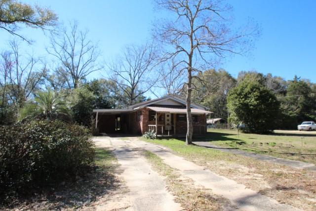 REO This is 3/4 of an acre in town of Holt.TLC and would make a great family home. Large kitchen with open dining area and living room with open floor plan. Beautiful genuine knotty pine walls. Great back yard with enough room for the play set or above ground pool.