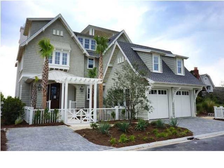 This is the Watchtower Plan, ask your sales associate for other options. This beautiful home has 4 bedrooms, a bunk room, 5.5 bathrooms plus a bonus room with 3680 square feet of living space, 1645 square feet of porches and a large 2 car garage. There is a summer kitchen with bar overlooking the pool. Salt-chlorinated pool has a negative edge and gas heater. There is a pool terrace for additional outdoor living area. The great room opens up to a screened in porch with a custom fireplace. Interior features include granite and limestone countertops, Dacor and Bosch appliances, custom molding, custom stone flooring and reclaimed hardwood floors throughout the home.