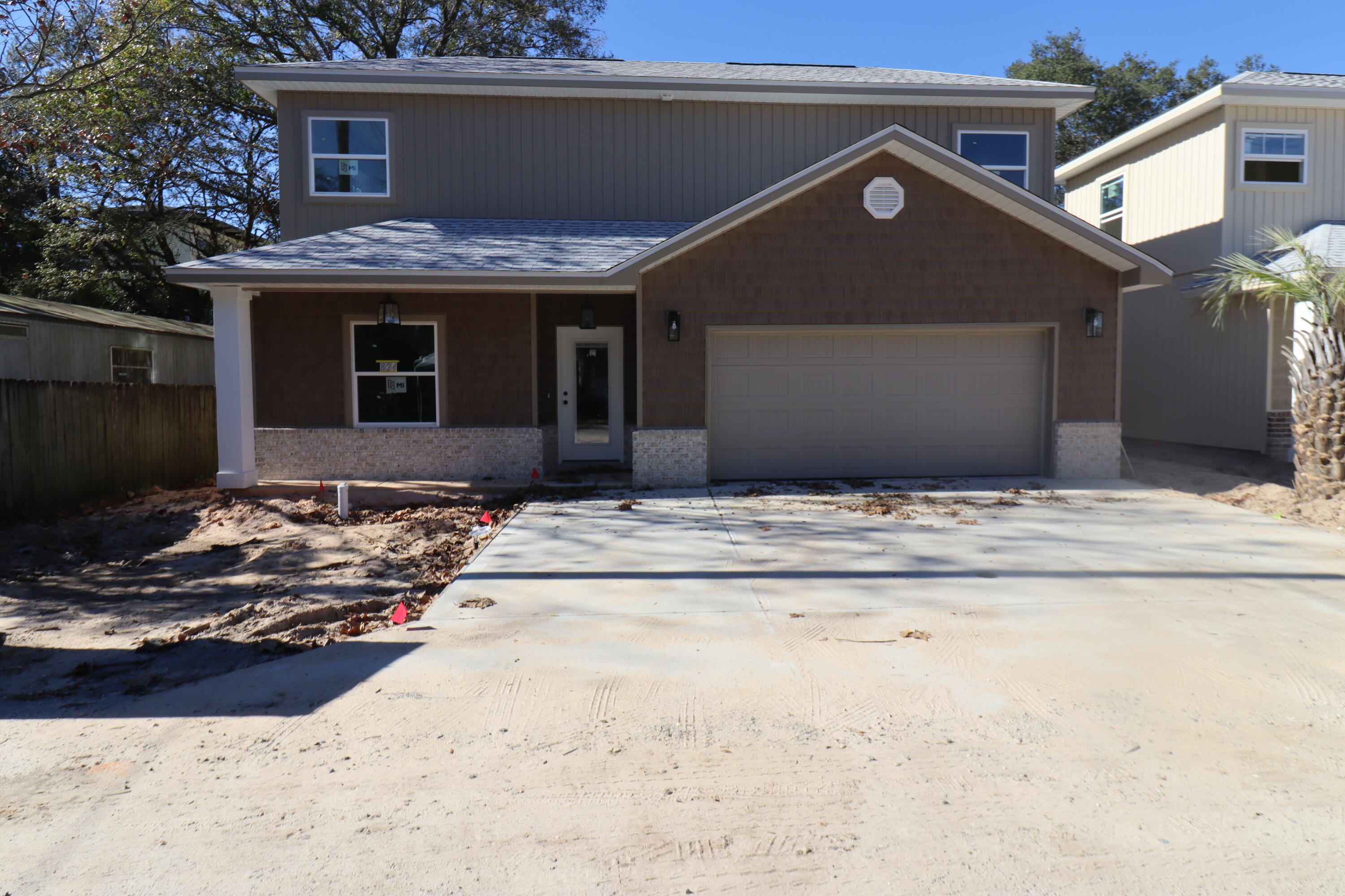 Builder offering to pay 4% of purchase price towards buyers closing costs and rate buy down if using preferred lender. New construction super close to shopping and very convenient to both bases. This 4/3 home has 9 Ft. ceilings w/ impressive crown molding, has LVP flooring throughout the entire home except wet areas that are tiled, and 5 1/4 '' baseboard. As you enter the home through the covered porch, bedroom 1 and bath 1 are located at the left of the home. Continuing down the hallway, the kitchen is on your right and has white painted cabinetry, will have stainless appliances and has granite countertops. The master bedroom is at the left rear of the home. Great room is located at the front of the kitchen. Bedrooms 3 and 4 are on the second level and share a bath tub/ shower combo and double vanity. Driveway is oversized. Yard will be landscaped and will come complete with a well, pump and timer.
