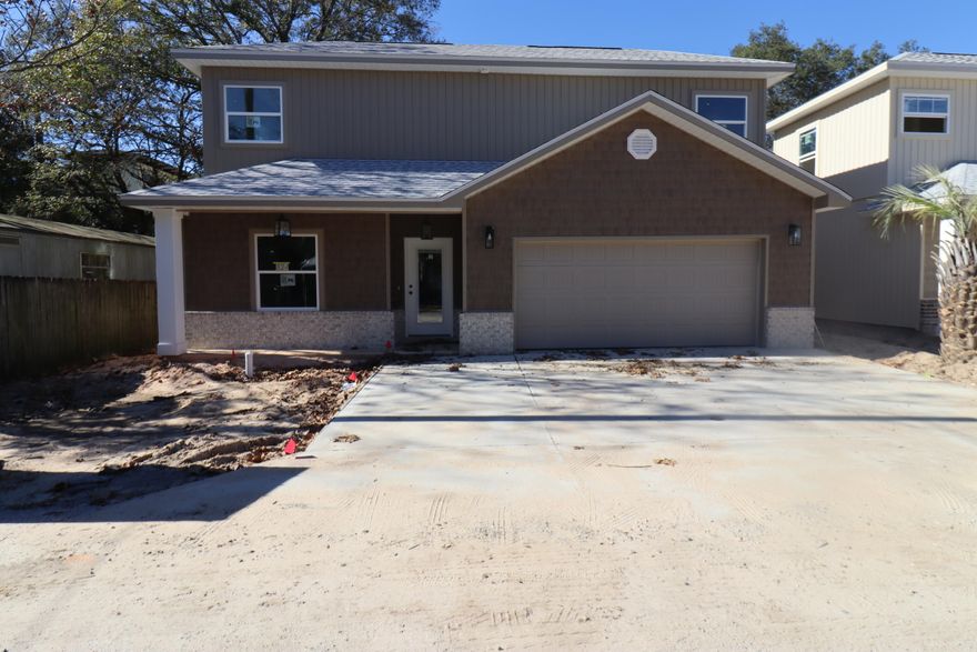 Builder offering to pay 4% of purchase price towards buyers closing costs and rate buy down if using preferred lender. New construction super close to shopping and very convenient to both bases. This 4/3 home has 9 Ft. ceilings w/ impressive crown molding, has LVP flooring throughout the entire home except wet areas that are tiled, and 5 1/4 '' baseboard. As you enter the home through the covered porch, bedroom 1 and bath 1 are located at the left of the home. Continuing down the hallway, the kitchen is on your right and has white painted cabinetry, will have stainless appliances and has granite countertops. The master bedroom is at the left rear of the home. Great room is located at the front of the kitchen. Bedrooms 3 and 4 are on the second level and share a bath tub/ shower combo and double vanity. Driveway is oversized. Yard will be landscaped and will come complete with a well, pump and timer. 