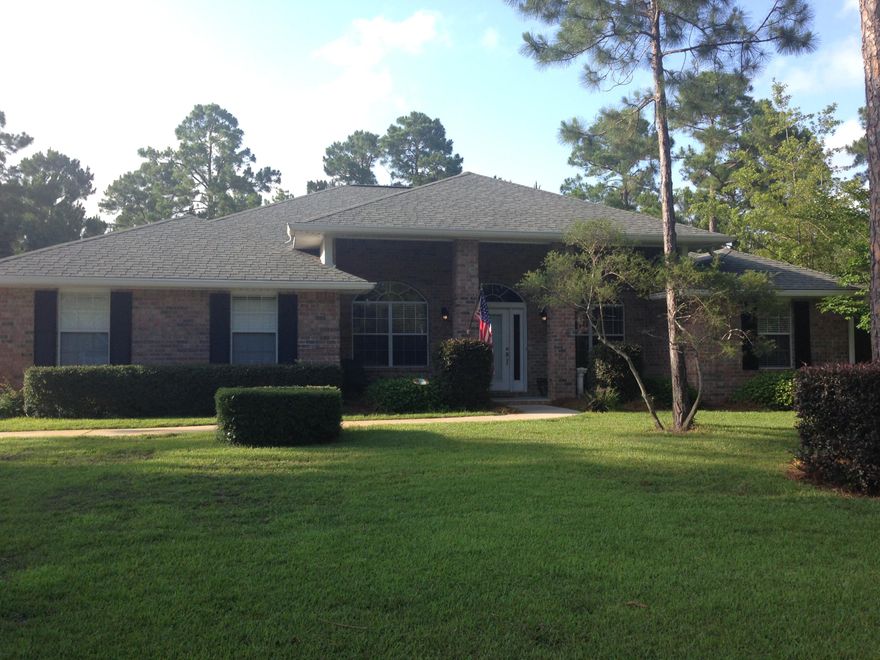 Large lot in Driftwood Estates features an all brick home with landscaping and partially fenced in backyard. Enjoy this 4 bedroom, 2 bath home with a 2 car garage. Formal dining room, family room, large living room with fireplace. Travertine tiled floors in the foyer, dining room, family room, living room and one of the bedrooms. Master bedroom has coffered ceiling and carpet. Master bathroom has tiled floors, double vanity with cultured marble counter tops, cultured marble whirlpool surround and separate shower. Kitchen has plenty of cabinet space, solid surface counter top and tiled floors. Living room features an electric fireplace with travertine floors and 10' ceilings. A screened in porch for your enjoyment in the back yard. Interior of the home was painted within the past