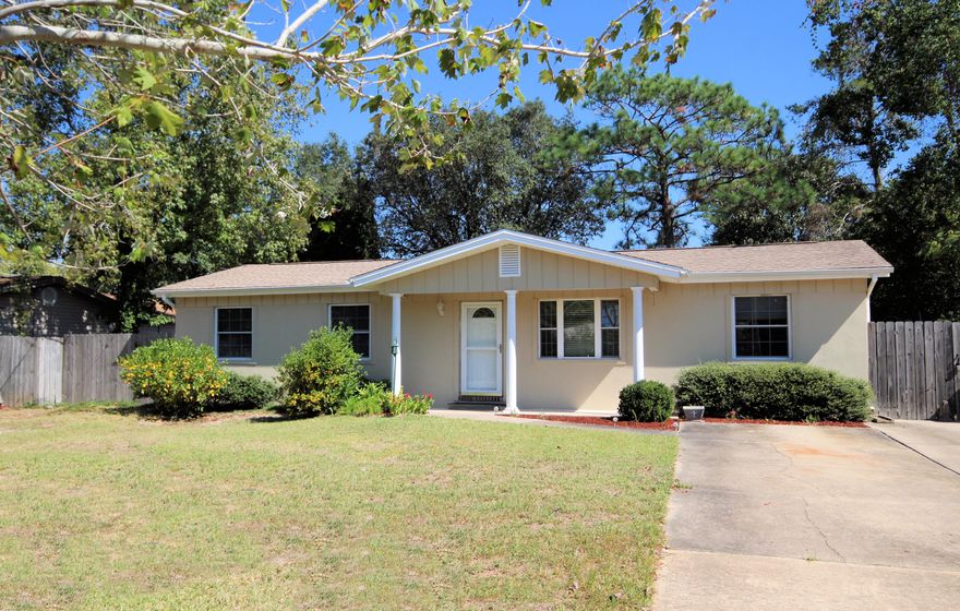 Perfectly Adorable Move-In Ready 3 Bedroom 2 Bathroom Home in the Desirable Shalimar area. You can see the LOVE the minute you drive up. Seller has re-wired the house. Copper Wiring!! Numerous Updates include: New Carpet in the Bedrooms, Tile in Kitchen and Bathrooms, Laminated Hardwood Flooring. Fresh Paint, Cabinets, Decorative Kitchen Wall Tile, Pass-Thru in Kitchen to Dining Area. Beautiful Breakfast Bar! Kitchen has lots of storage. This home features new Plumbing Fixtures, New Lighting, Ceiling Fans, 2 Inch Blinds, Crown Molding and Chair Railing. Lovingly Landscaped Front Yard and very Private, Beautiful Backyard. Concrete Patio for Grilling. Additional Parking Pad allows for numerous vehicles. Buyer to verify all measurements. You really owe it to yourself to see this house!