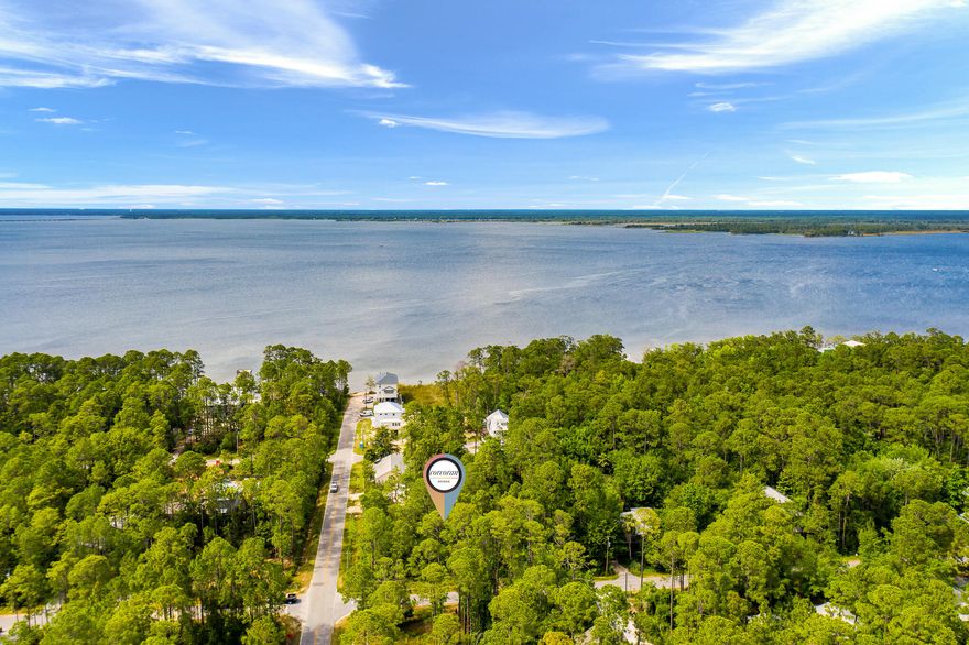 Double Lot in Point Washington less than 600 feet to Choctawhatchee Bay.  Sale includes house plans for a handicap accessible 3B/2B, 1,412 sq.ft Florida Cottage.  Magnolia Beach is a desirable Bayfront community with no HOA or buildout time.  Less than 5 minutes to the white sandy beaches of Grayton Beach and the Gulf of Mexico along Scenic Hwy 30A.  This homesite is perfectly suited for a full time residence, long term rental, or short term rental.  Launch your jet skis, boats, paddleboards and kayaks all within walking distance to community boat ramp.  35 minutes to Panama City Beaches International Airport.  Make your beach dreams a reality!
