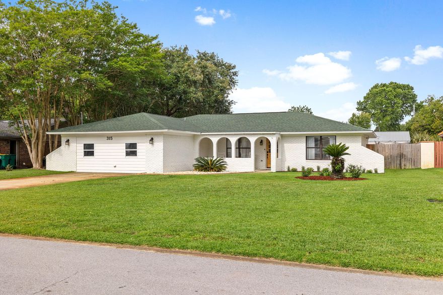 **MOTIVATED SELLER**Nestled in the heart of Destin, in the Kell-Aire Gardens neighborhood, is this stunning Ranch style gem. Upon arrival you are greeted with a fresh exterior paint job & brand new flower beds &  sod. Walking through the new craftsman style front door, you enter into a magazine worthy, split bedroom home. The calm & bright open concept living, dining & kitchen area are perfect for your big family or your next gathering. The kitchen boasts Quartzite Counters, updated appliances and a brand new gas range. Your large living room has a beautiful and functional wood burning fireplace, perfect for cozy Christmas memories with your family.  Off the kitchen you will find the spacious Primary Suite with its amazing walk in closet and large Primary EnSuite with custom walk in show