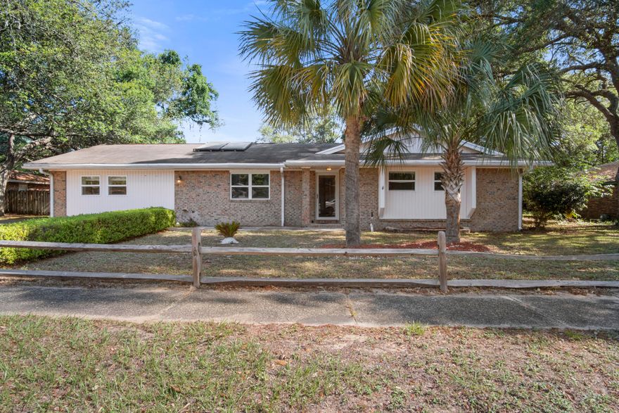 This one won't last long ! This spacious home is laid out for you to ENJOY life in the heart of Niceville in an established neighborhood with sidewalks, mature landscaping, and zoned for top-rated Niceville schools. Your lovely new home has TWO master suites in addition to two spacious bedrooms (one with built in bookshelves) sharing a hall bath. Solid-surface flooring throughout with hardwood and tile! The formal living room and dining room are both easily accessible from the kitchen, which boasts 42'' maple cabinets, Corian counter-tops, recessed lighting, and more. You'll love cooking on the GAS stove (2019)! Laundry room is conveniently adjacent to the kitchen. Enjoy the huge backyard from the Florida room, located off the kitchen and dining room. (see supplement)