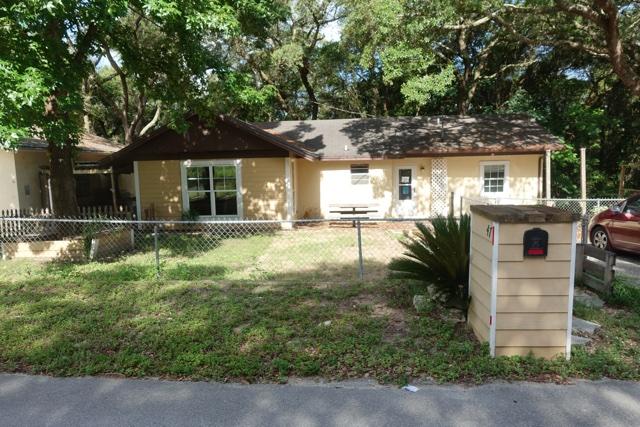 Cute unique home on a quiet side street, from this location you have prime access to Eglin AFB and Niceville. This 3 bedroom 2 bathroom has a butcher block counter top island, an open floor plan, and combined living/dining area. Outdoor area is perfect for grilling out and staying cool in the shade of the breezeway created by the home and the detached garage. Detached garage is perfect for the car enthusiast as the previous owner used it for rebuilding cars. Or use the built in bar for entertaining guests! Plenty of room for game tables if you wanted to convert it to a separate living space! Come see this deal as it wont last long! **Property was built prior to 1978 and lead based paint potentially exists.**
