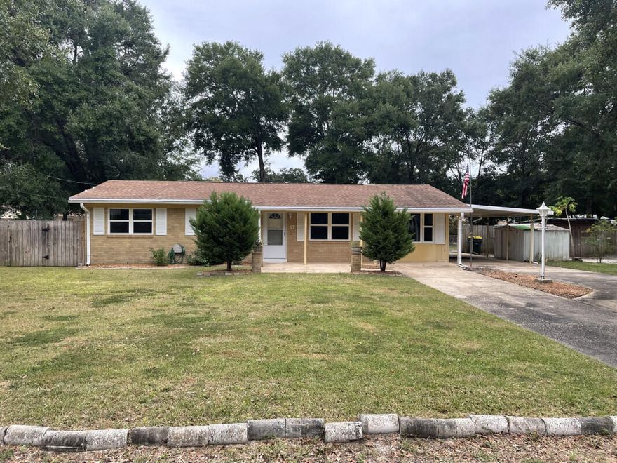 This is a three bedroom home which can easily be converted to a four bedroom. It sits on one and a half lots and is located centrally to shopping, both bases, schools and beaches. All new interior paint, tile floors and ceiling fans.  It also has a large pantry. Large dining room, and two extra rooms which can be used for an office/hobby room or play room. Screened in porch. Side by side refrigerator with icemaker works but is 'as is'.