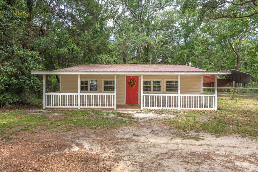 A NEW BlueRidge MiniSplit was installed July 2020. This fantastic home is situated on a double lot and is a fisherman's paradise. As you enter the home, you'll find the first bedroom to your immediate right, which features an en-suite bathroom. The additional bedroom is located across the hallway, to the left as you enter the home. As you continue down the hallway you're greeted with an open concept area that features the living room, dining and kitchen area. This open concept is a great space for entertaining! As you continue to head towards the back of the home, you'll find a secondary full bathroom and additionally, a large storage and laundry area. The property is fenced in entirely and the backyard features a covered parking area that is perfect for boat or car storage.