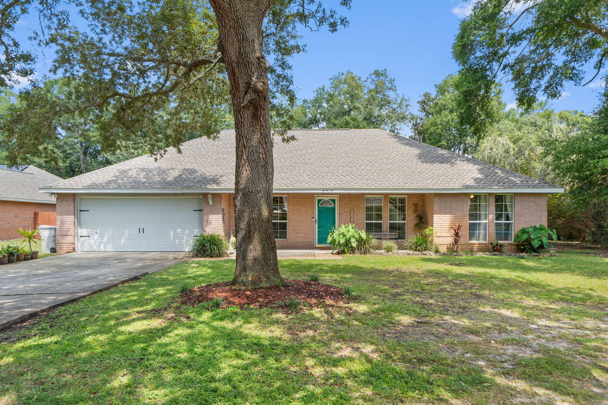 Discover this charming 4 bed 2 bath, pool home nestled in the sought-after Robledal neighborhood. Spread across the 1,900 sqft, this home offers a relaxing atmosphere with mature trees and a natural backyard setting w/ a large sparkling pool surrounded by lush greenery, creating a perfect retreat. Recent upgrades include a new roof and water heater (2024) and an HVAC system (2025), Inside, you'll find a welcoming layout with the kitchen at the heart of the home, a cozy living room with a fireplace, and a split floor plan--perfect for privacy. The spacious master suite & living room opens to a sunny Florida room. Optional HOA membership for a one time fee, provides access to boat launch and picnic areas, ideal for outdoor fun on the beautiful East Bay. Santa Rosa County School District is an "A" rated district. Located only 10 miles to Navarre Beach and 18 miles to Pensacola Beach. Call to make an appointment to view this beautiful home!