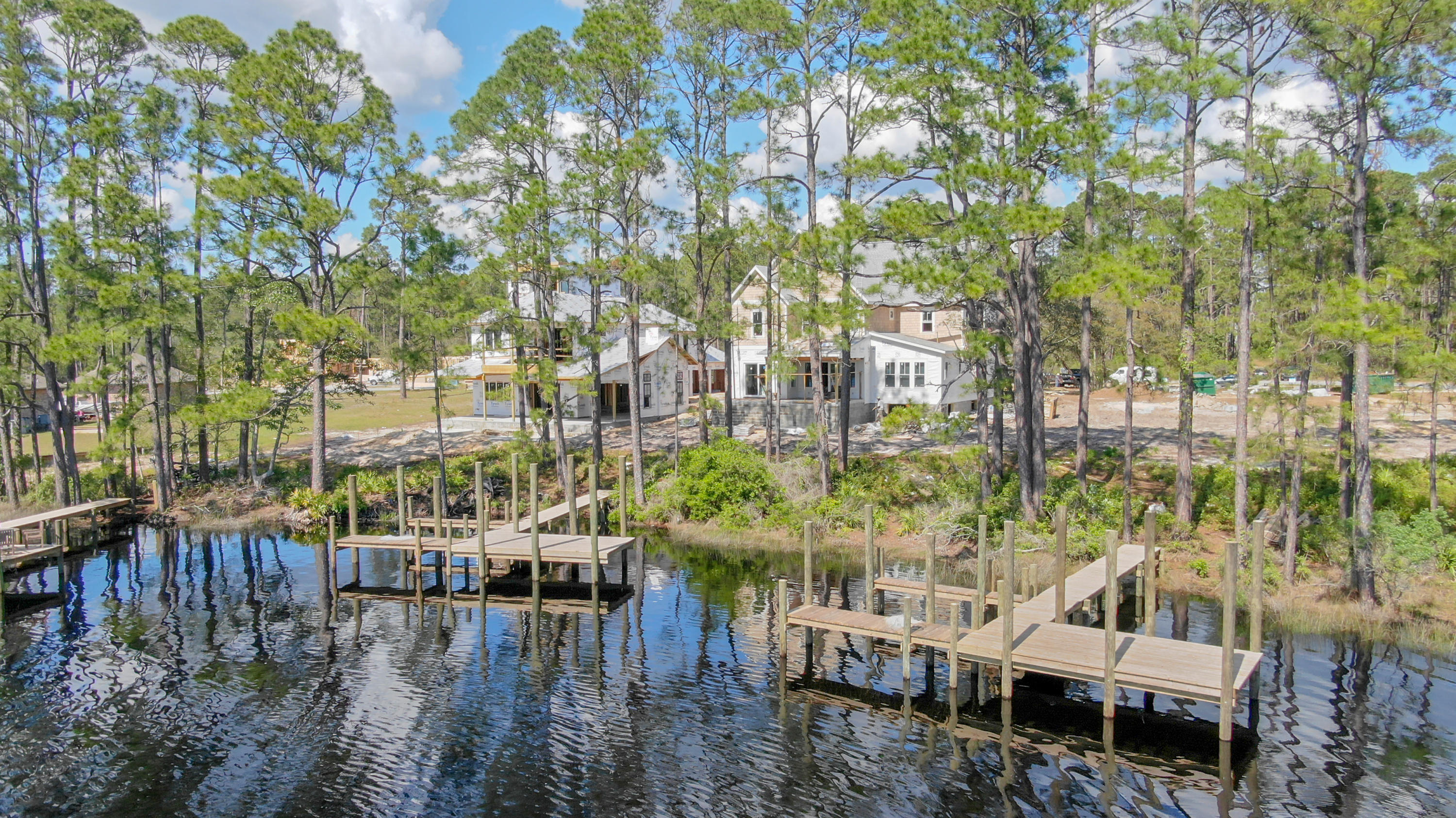 Great new Project with multiple new homes just outside of Wild Heron. This is a vacant lot with dock that has a boat lift section. The lot is cleared and ready to build right on the lake.