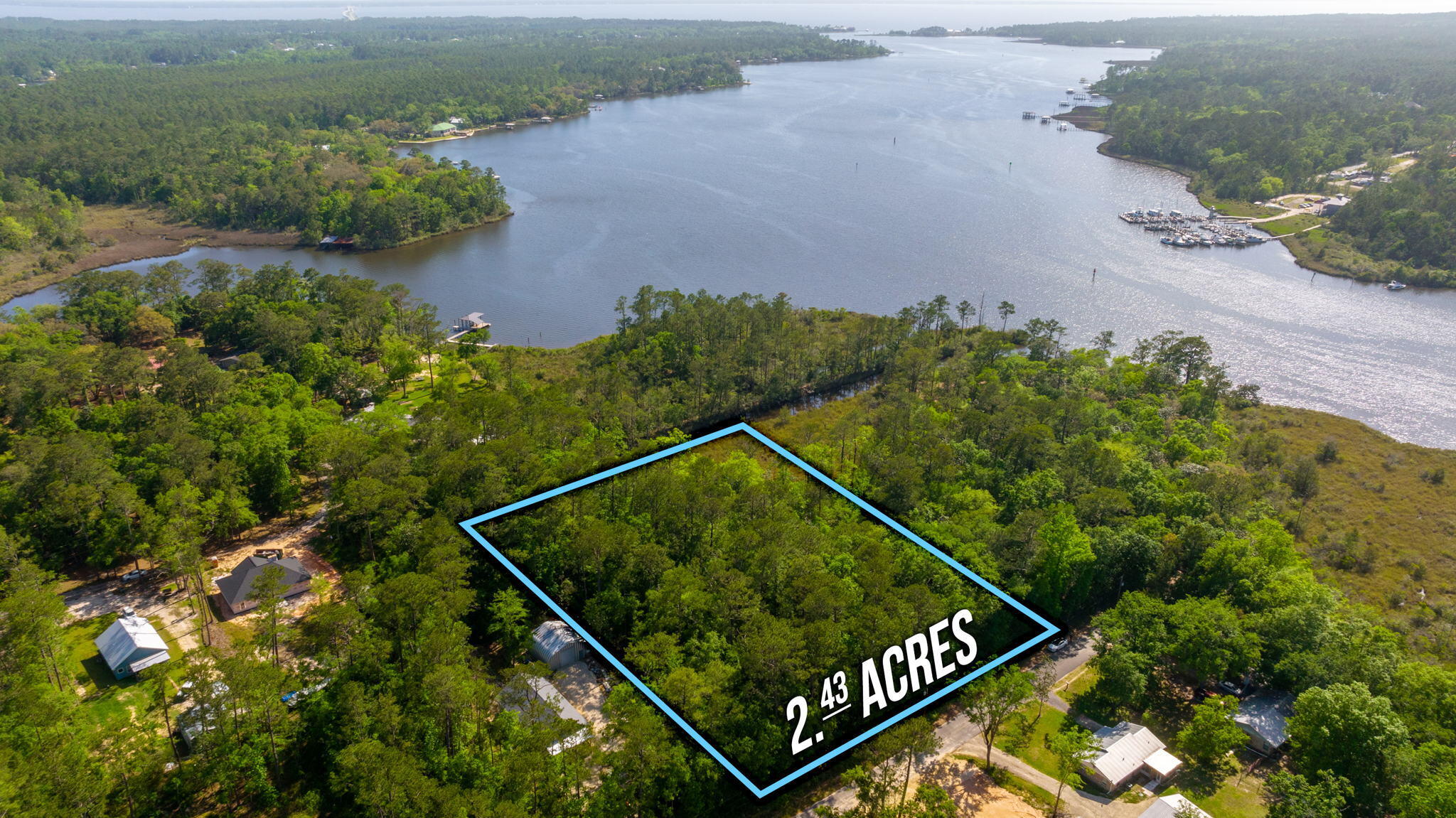 6 beautiful lots totaling about 2.4 acres (we believe it to be closer to 2.9 acres, TBD by survey if buyer chooses). Many options, build your dream home or use it as a vacation retreat. This property has a canal on the southwest corner opening up to LaGrange Bayou which connects to the Choctawhatchee Bay. You have to walk this property for yourself to see its true beauty. Only approximately 1 mile from the heart of Freeport, you are close to shopping and only about a 20 minute drive to the Beautiful white sandy beaches of South Walton. It's not often that you find properties of this size in the area. We have been told by the city that public water is available on this street. No sewer available, it would require a septic at this time.