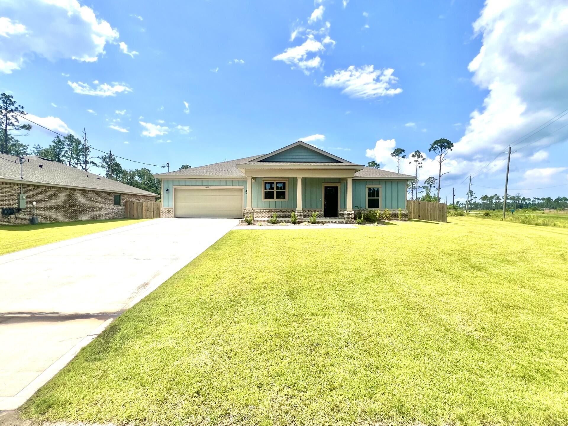 Builder offering $10,000 in buyer concessions to be used any way you'd like! Located in an X flood Zone and NO wetlands, this exceptional new home features many upgrades throughout. Clad with the timeless durability of brick, cement fiber board accents, and an architectural shingled roof. Interior offers luxury vinyl plank flooring in the common areas, visually pleasing neutral tile in the baths and laundry room, and carpet in the bedrooms. Custom paint color is accented with a wide baseboard, beautiful crown molding, and spectacular tray ceiling accents in the master bedroom, dining and entry area. Transom windows over the hall entryways provide a high-end custom touch. Stainless steel appliances including refrigerator, stunning shaker style cabinets, and