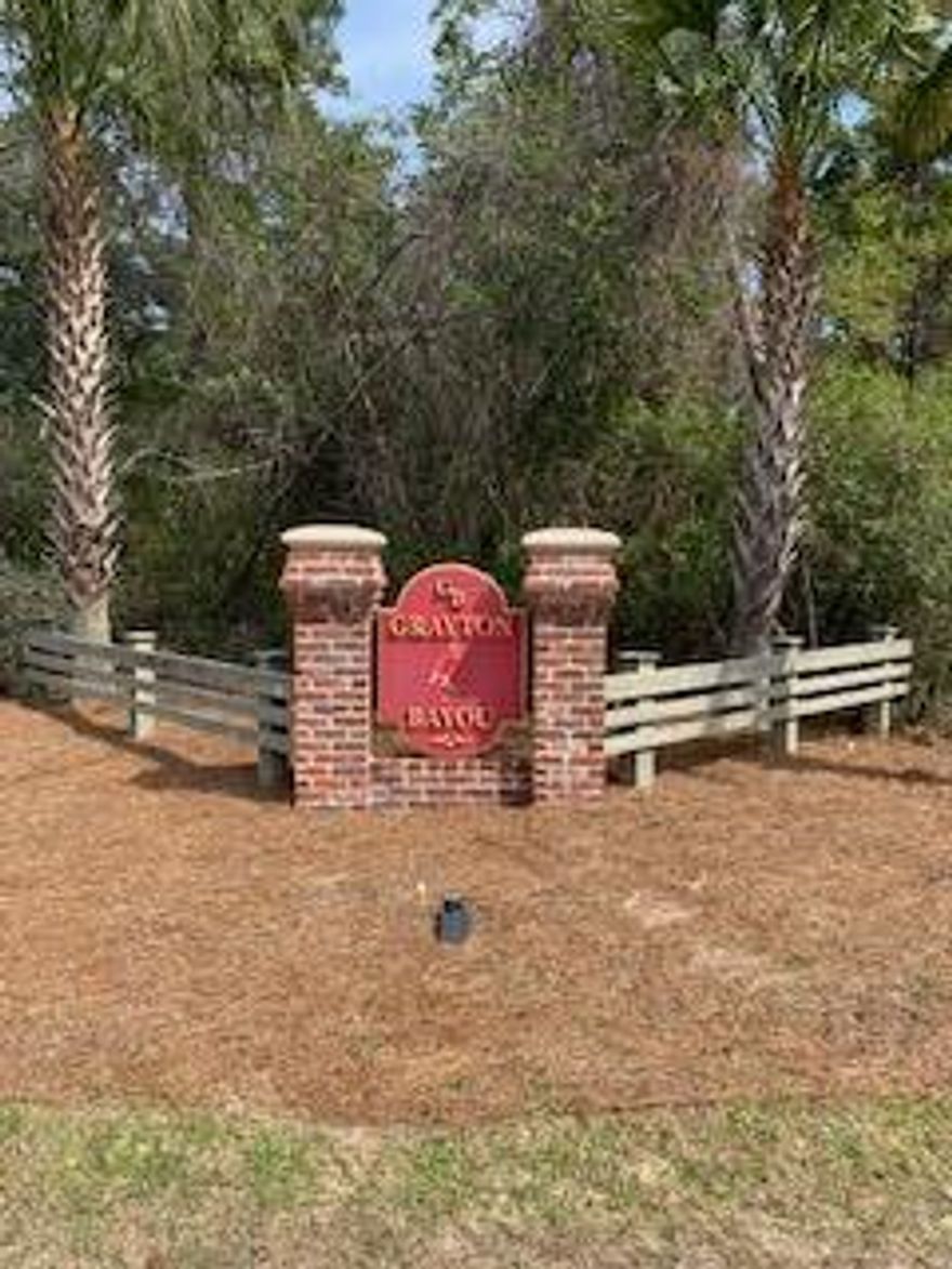 Perfect lot for your new beach home in beautiful Grayton Bayou, only 5 minutes from Grayton Beach. Enjoy palm tree and oak lined streets with stamped brick paving, a community pool, bayfront park, and community boat launch. Beautiful wooded lot with a rear entry alley way. Grayton Bayou requires a Florida cottage style home with a minimum size of 1600 sq'.
