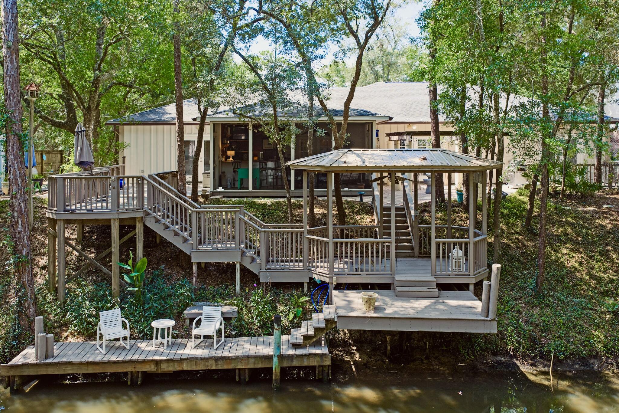 Canal Front Living with Bay Access & NO HOA!Tucked away in the Mack Bayou area with no HOA restrictions, this spacious one-level, 4-bedroom, 3.5-bath home sits directly on a canal with direct access to the bayou and Choctawhatchee Bay--perfect for boating, paddle boarding, jet skiing, canoeing, or kayaking right from your backyard.The home is move-in ready and waiting for the right buyer to bring their vision and add their personal stamp. Whether you're looking for a primary residence, vacation home, or long-term investment, this property offers the freedom and flexibility rarely found in Santa Rosa Beach. There's plenty of space to relax, host guests, or simply take in the tranquil canal views. Grand Boulevard, Sacred Heart Hospital, Publix, and the world-class dining, shopping, and beaches of 30A--this property blends convenience with coastal living.
No HOA
Deep water canal with bay access
Fully furnished option available
Outdoor entertaining spaces
Flexible floor plan with guest suite potential
Bring your boat, your vision, and make this canal-front home your own.