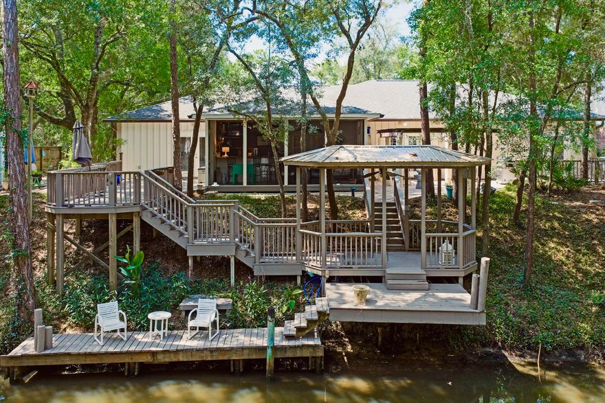 Canal Front Living with Bay Access & NO HOA!Tucked away in the Mack Bayou area with no HOA restrictions, this spacious one-level, 4-bedroom, 3.5-bath home sits directly on a canal with direct access to the bayou and Choctawhatchee Bay--perfect for boating, paddle boarding, jet skiing, canoeing, or kayaking right from your backyard.The home is move-in ready and waiting for the right buyer to bring their vision and add their personal stamp. Whether you're looking for a primary residence, vacation home, or long-term investment, this property offers the freedom and flexibility rarely found in Santa Rosa Beach. There's plenty of space to relax, host guests, or simply take in the tranquil canal views. Grand Boulevard, Sacred Heart Hospital, Publix, and the world-class dining, shopping, and beaches of 30A--this property blends convenience with coastal living.
 No HOA
 Deep water canal with bay access
 Fully furnished option available
 Outdoor entertaining spaces
 Flexible floor plan with guest suite potential
Bring your boat, your vision, and make this canal-front home your own.