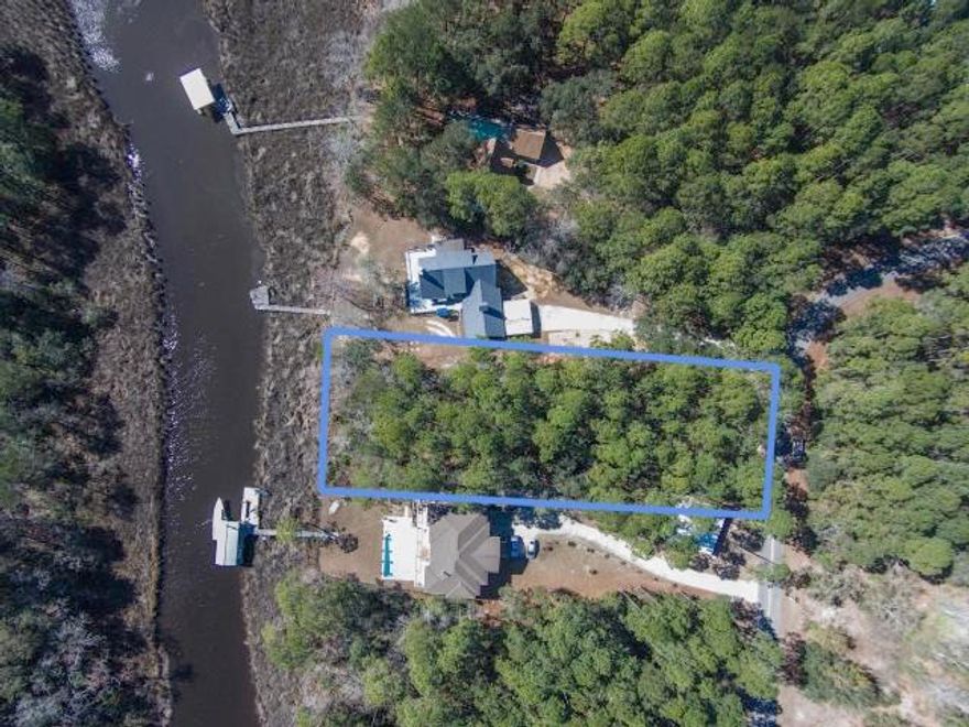 Price improvement! This is a gorgeous homesite with beautiful hardwoods and palmetto palms on this level lot with approx. 92 ft. of bayou frontage that leads to LaGrange Bayou and the Choctawhatchee Bay. This lot is .71 acre and sits on a quiet road away from the congestion, but still a short distance to shopping and the beach. Don't miss this opportunity to build your dream home. All dimensions should be verified by buyer.