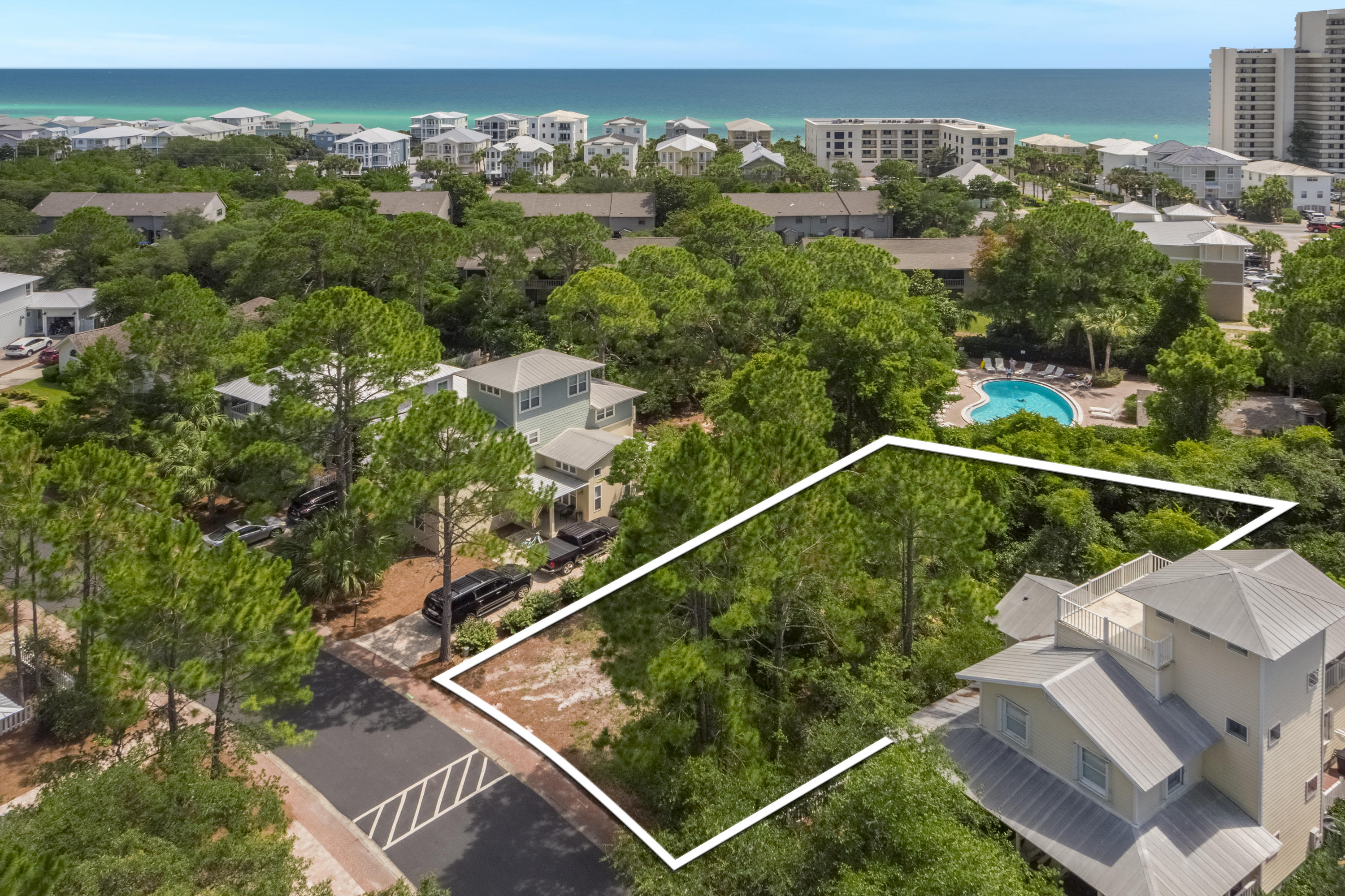 Beautiful lot situated on the south side of the charming community of Cassine Village. This neighborhood amenities include two pools, tennis courts, nature trails. Build your dream home within walking distance to the wonderful shopping, eating, and of course - world class beaches of 30a! Rear of lot backs up to the community pool, come take a look!