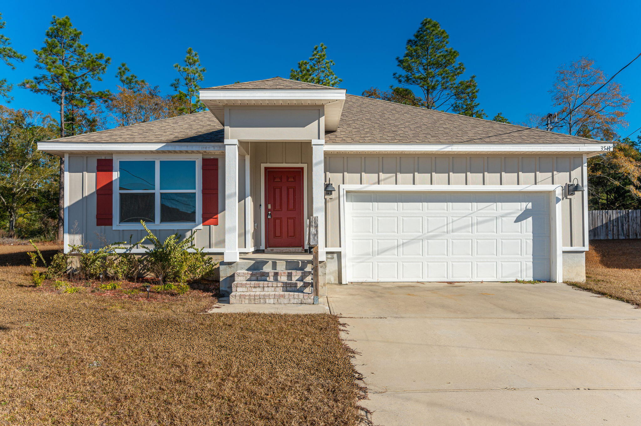 Welcome to Timberland Ridge, where charm meets functionality in this stunning craftsman-style home. Featuring 4 bedrooms and 1,800 sqft. of thoughtfully designed living space, this cozy gem is a must-see.The hardie board siding on the exterior offers durability and low maintenance, while the open-concept interior welcomes you with an abundance of natural light, neutral tones, and a layout that feels even larger than it already is. The spacious kitchen is a chef's dream, offering ample cabinet and countertop space--perfect for family meals, culinary adventures, or entertaining friends. And here's the cherry on top--the refrigerator, washer, and dryer are included, making this home move-in ready! Step outside to enjoy the oversized backyard, which includes 8,000+ sq. ft. of additional space past the current tree line. Whether you envision a garden, play area, or private oasis, the possibilities are endless.