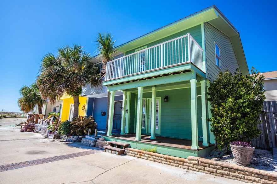 This beautiful, move in ready townhouse is located on Holiday Isle just steps from the beach access. Homes on this privately owned street don't come available often, so don't miss out! This can be either an amazing vacation rental or the perfect spot to call home. Enjoy your mornings on the front balcony watching the sunrise or take a stroll on the beach to watch the sunset over the east pass. The neighborhood is quiet, safe, and has amazing neighbors. The home has fresh paint, tile floors throughout, and 2 bedrooms upstairs with balconies. And the back patio area is a blank slate to turn in to your personal oasis.