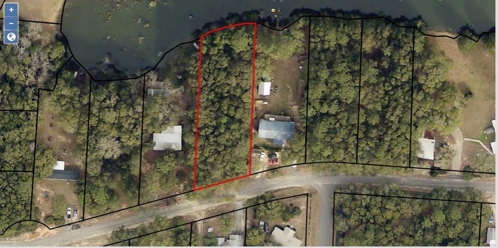 PRICE REDUCED! Great waterfront lot on the lake! Roughly .5 acres on a paved road. There are no known utilites on the lot, but are available in the area. Zoned residential, mobile homes ok. Bring your home, or build plans today!
