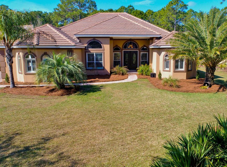 Move into this IMMACULATE gated golf course community today! 3 bedroom, 3 bath, office, and 2+ garage, Mediterranean home on 1/2 acre lot w/ private fenced in back yard overlooking nature preserve. Open floor plan with views to the screen enclosed pool lanai and summer kitchen! Formal dining room with floor to ceiling columns and a 3 tier tray ceiling. Ceilings 10-16' with 8' doors. Recently renovated state-of-the-art kitchen boasts stainless steel appliances, gas stove, custom soft close drawers and cabinets, granite counter tops, hanging pot rack, copper farm sink w/ oil rib bronze fixtures and separate wine cooler, auto HURRICANE shutters, ''Smart Home'' tech controls security cameras, garage door, thermostat, surround sound, built in speakers, crown molding, and so much more...