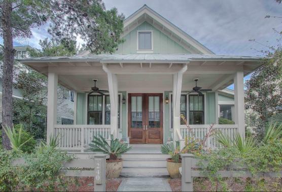 Located in the sought after Lake District in WaterColor, its lush greenery and old Florida charm will definitely be the ''Welcome Home'' you've been looking for. This immaculate 5 bedroom 4.5 bath home is sure to check all the boxes including professionally decorated decor and furnishings to the carriage house that offers a second master suite! This truly is a classic Watercolor home! When entering the home, you will be welcomed by the tall vaulted ceilings in the great room, with its beautiful hardwood floors and warm tones. The kitchen offers high end Thermadore appliances, granite counter tops, glass backslpash, stunning cabinetry and a breakfast bar. Off the kitchen features a built-in office area, full laundry room with an owners closet and plenty of cabinets for storage.