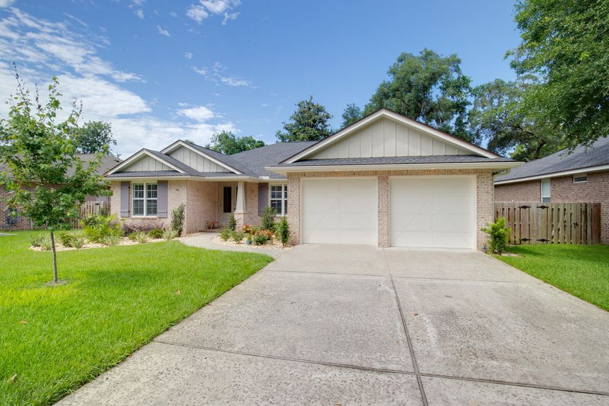 Beautiful brick home located in sought after Elliott Point neighborhood. Close to downtown and beaches. This home was built with attention to details. Oversize windows and doors allow for natural light and an open feel. Crown molding and custom trim give this home an exclusive look. Bonus room would make an excellent office or additional bedroom. Kitchen has a center island with breakfast bar, gas range and custom hood vent. Off the kitchen, there is a breakfast nook in addition to the open formal dining room. Master suite includes a spacious bathroom with double vanities, separate shower and garden tub, and a large walk-in closet.Move in ready with fenced back yard, indoor laundry and two car garage. Home includes a Tankless gas water heater and solar power system that will significantly