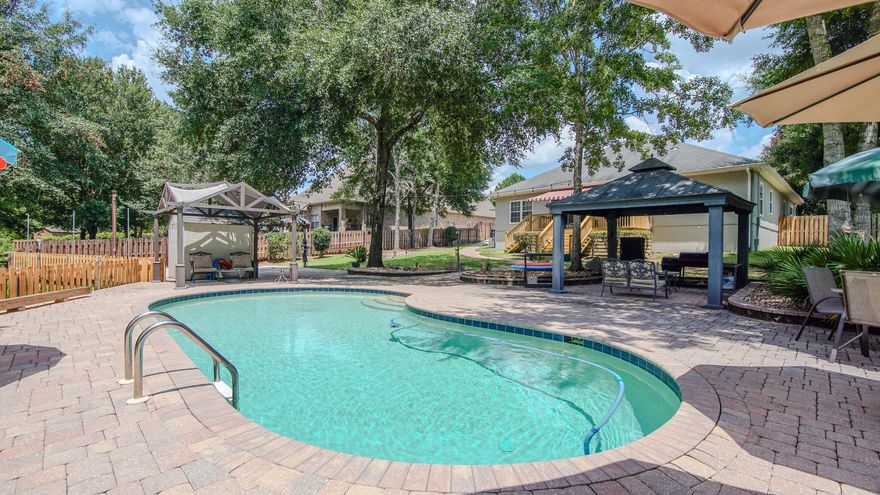 Welcome to 158 Whispering Way in the highly sought-after Hammock Bay community of Freeport. This beautifully updated 5-bedroom, 3.5-bath home offers 2,824 square feet of thoughtfully designed living space, perfectly positioned on an oversized 0.41-acre lot backing up to preserved land--ensuring lasting privacy with no rear neighbors. Step outside to your own private outdoor retreat featuring a heated inground saltwater pool, brand-new deck, basketball court, fully fenced backyard, and additional storage with a backyard shed. A whole-house generator provides added peace of mind, while recent upgrades including a new roof, freshly painted stucco exterior, hurricane shutters, and a well-maintained HVAC system (2020, on biannual service plan) make this home truly move-in ready. Inside, the spacious and functional layout is ideal for both everyday living and entertaining, offering comfort, flexibility, and room to grow.  Whether you're enjoying quiet mornings overlooking the preserve, relaxing poolside, or hosting gatherings with family and friends, this home delivers the perfect blend of privacy, convenience, and long-term value. Built in 2008 and thoughtfully updated, this is a standout opportunity in one of Freeport's most desirable communities.

Community Features:
Hammock Bay is a master-planned, resort-style community located just minutes from the beaches of South Walton and 30A. Residents enjoy:
Three beautifully designed clubhouses, two with pools and lounge areas 
State-of-the-art fitness center
Tennis, basketball, and pickleball courts
Miles of walking and jogging trails
General Store, event lawn, dog parks, and playgrounds
Lake Club with waterfront clubhouse and dock overlooking the bay
Regular community events and seasonal markets that create a true neighborhood feel.