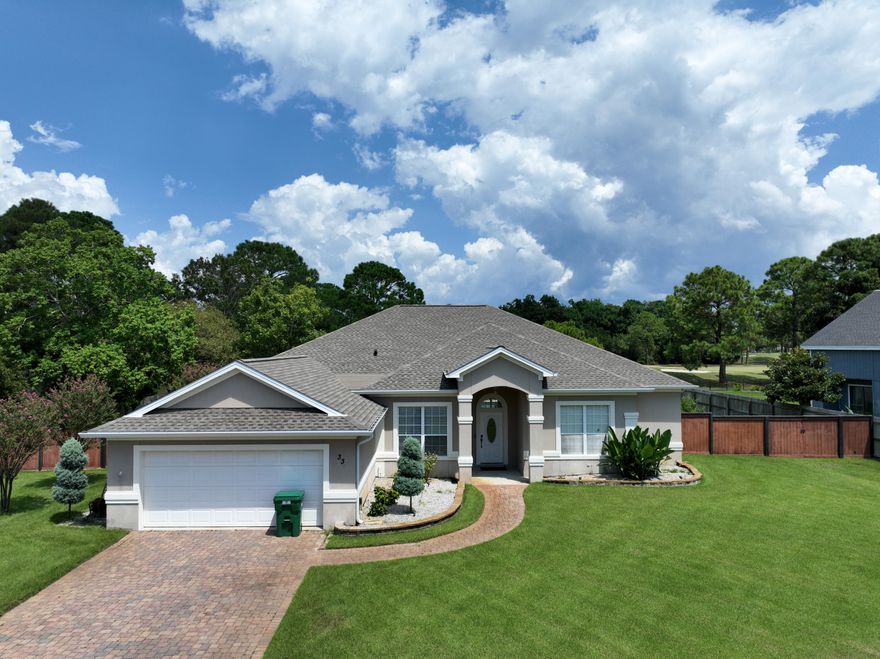 Back on the market due to an unexpected job relocation--this home is priced for a quick sale! 33 E Country Club Drive offers light-filled living spaces with expansive windows, a custom kitchen, and a primary suite with dual vanities and a large walk-in closet. The fenced backyard is built for entertaining with a heated saltwater pool, new safety gate, and pavilion. Perfectly positioned between the 8th green and 9th tee of Indian Bayou Golf Course, the setting offers privacy, scenic views, and leisure. Added perks include a Tesla Universal EV charger and a versatile bonus mudroom. Just minutes to beaches, dining, and shopping, this Destin retreat combines comfort, convenience, and lifestyle.