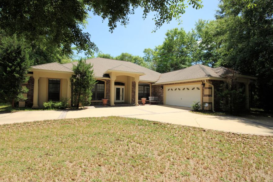 Exquisite luxury home with everything you would expect and more, located on a tranquil corner lot in Juniper Creek S/D. Enter through lovely lead glass doors to find dramatic details everywhere starting with 11' ceilings, oversize crown molding and crystal chandeliers. The great room has beautiful hardwood flooring, gas fireplace and check out the ceiling. The kitchen is a dream with custom cabinets; granite counter tops, breakfast bar, and a kitchen island with a prep sink and wine frig. Kitchen is fully equipped with top of the line stainless appliances; refrigerator, dishwasher, trash compactor, double convection ovens, gas range and built in microwave. Your master suite also has warm hardwood flooring and an entrance to a bath that would make any spa jealous.