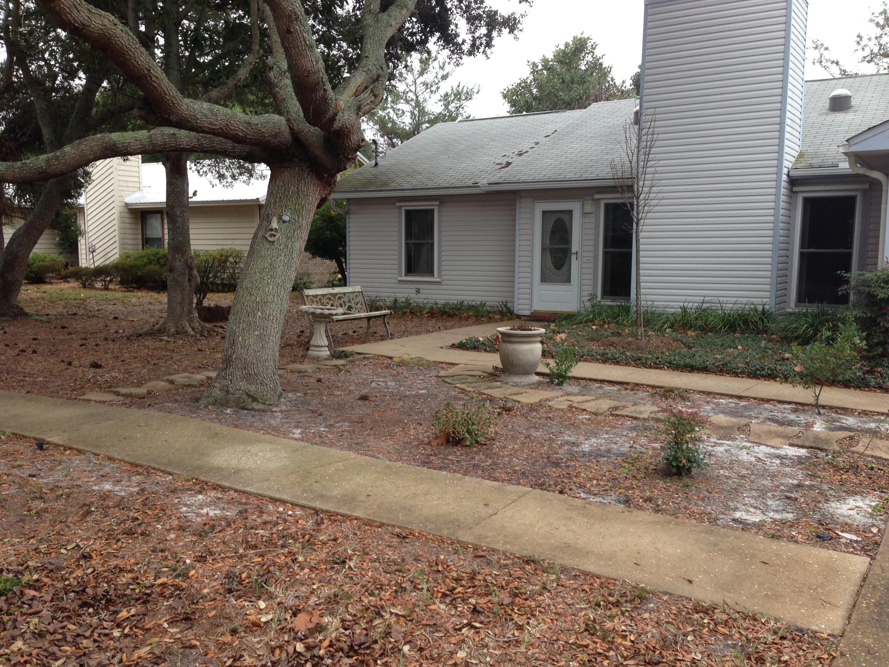 3 bedroom 2 bath home tucked away in the heart of Destin! Open floor plan offers tile in living room, dining room, and kitchen areas. Living room has wood burning fire place while the Kitchen has a buffet area for extra counter space. All bedrooms are fully carpeted. Master bedroom has walk-in closet AND sliding glass door to a small deck area in the backyard. Screened in porch off the kitchen makes for great area to BBQ. Wood privacy fence in the backyard as well.