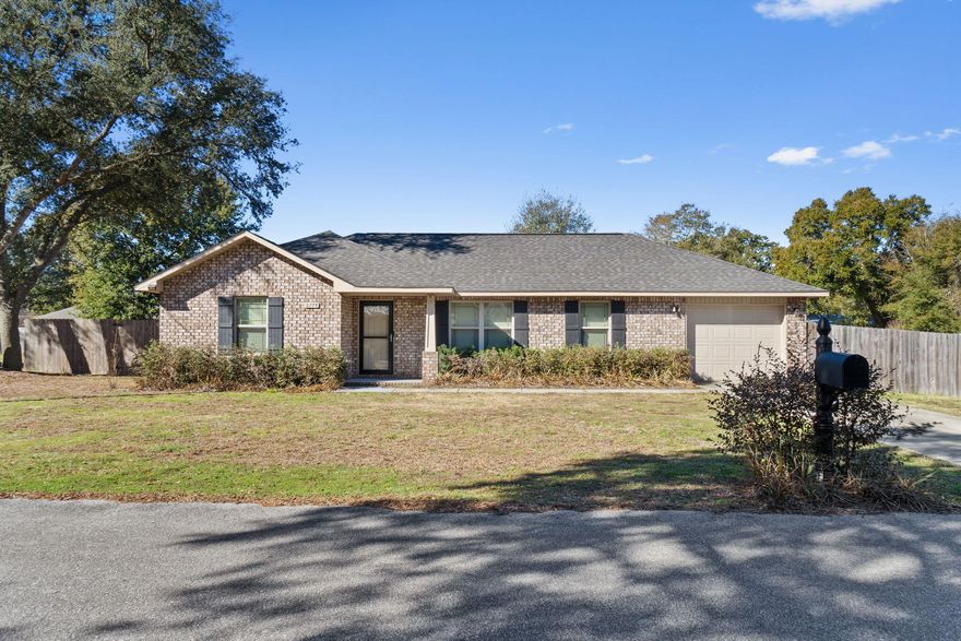 Welcome to this adorable all brick Navarre home on a great sized 0.26 acre lot with a large backyard and no HOA! Featuring 3 bedrooms and 2 bathrooms in a split floor plan enter inside and immediately appreciated the vaulted ceilings and the great sized family room space. The dining space is open to the kitchen which has stainless steel appliances, ample cabinet space with a pantry. From there you can access the interior laundry room with a door to the one car garage complete with an automatic garage door opener. The master bedroom features brand new carpet with a walk in closet and it's on en suite. On the other side of the house are the other two great sized bedrooms with ample closet space. Both the front and the back of the home have covered patios to enjoy. You'll love the easy commute to Hurlburt Field and being minutes to Navarre's gorgeous emerald coast beaches. Welcome home!