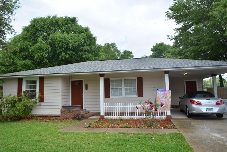 Come see this ADORABLE home in the heart of Ft Walton Beach! Gorgeous HARDWOOD flooring in all Living Areas and Bedrooms. TILE floors in all the wet areas. UPDATED KITCHEN CABINETRY in the Kitchen and new COUNTER TOPS. Laundry Room also has new cabinetry for storage. Other Features Include: Freshly Painted Textured Walls, New 6 Panel White Doors, New Lighting, New HIP Roof in 2012, Lush Landscaping, New Privacy Fence, New Vanities in Master Bath, Large Tiled Master Shower, New Gas Hot Water Heater in 2011 and more! Outdoor Shower in Backyard and 2 Shed/Workshops in back yard. Great location close to schools, shopping, and only a 5 minute drive to the Beach! Call for more information!
