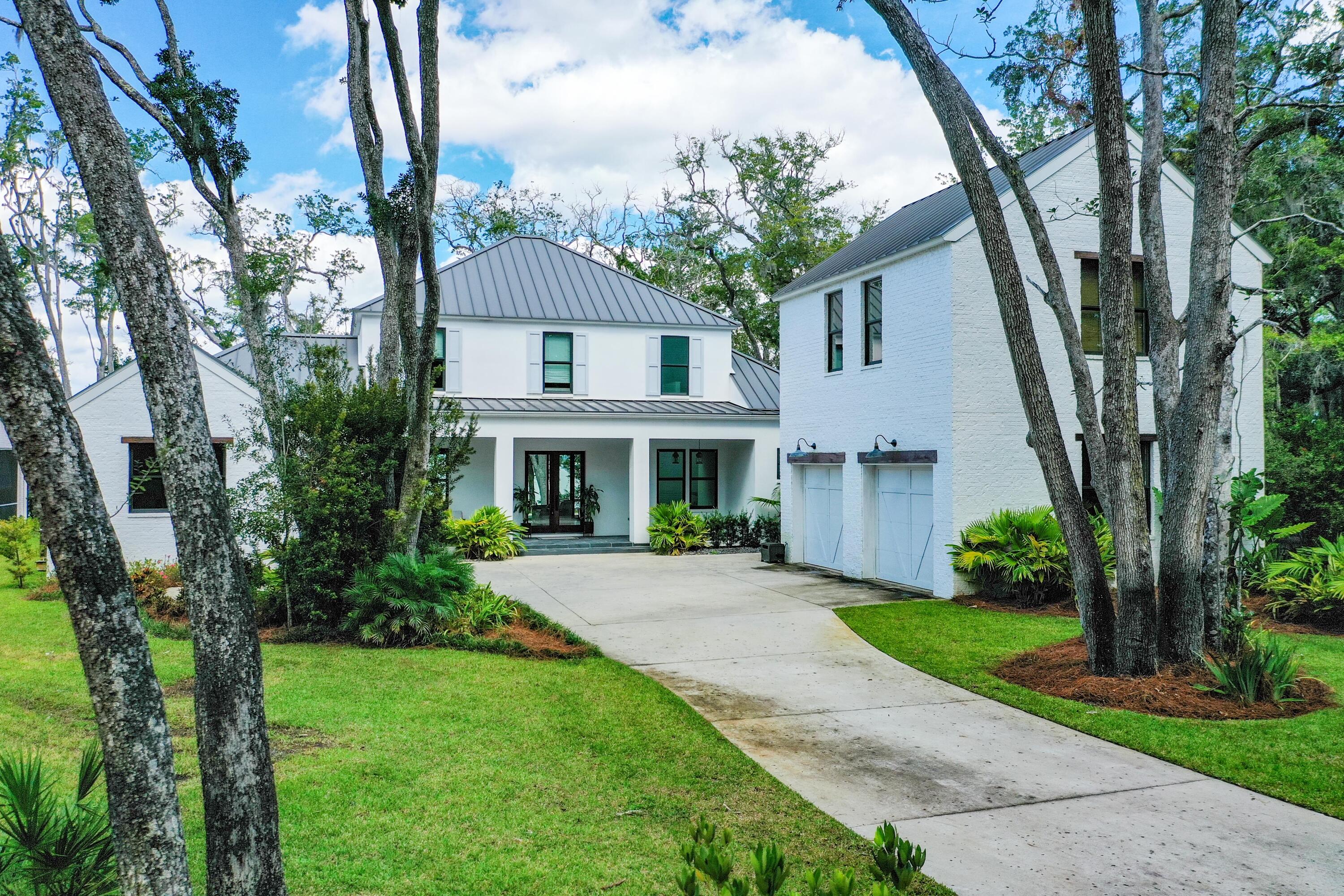 Bay-front living at it's best with this beautifully constructed home in Point Washington. The Woods neighborhood offers a peaceful escape with world class boating all just minutes from the beaches that have made 30A famous.  Seaside, Grayton Beach and Seagrove beaches are just a few minutes from the house.  Entering the home you are greeted with expansive bay views through the open living area. The spacious kitchen with quartzite countertops and a Wolf gas range leads to a screened in porch with an outdoor grill and sink and pool area. White oak floors can be found throughout the home. There is a newly installed dock with a 12,000 lbs boat lift and 2 Jet Ski lifts for easy access to the bay.