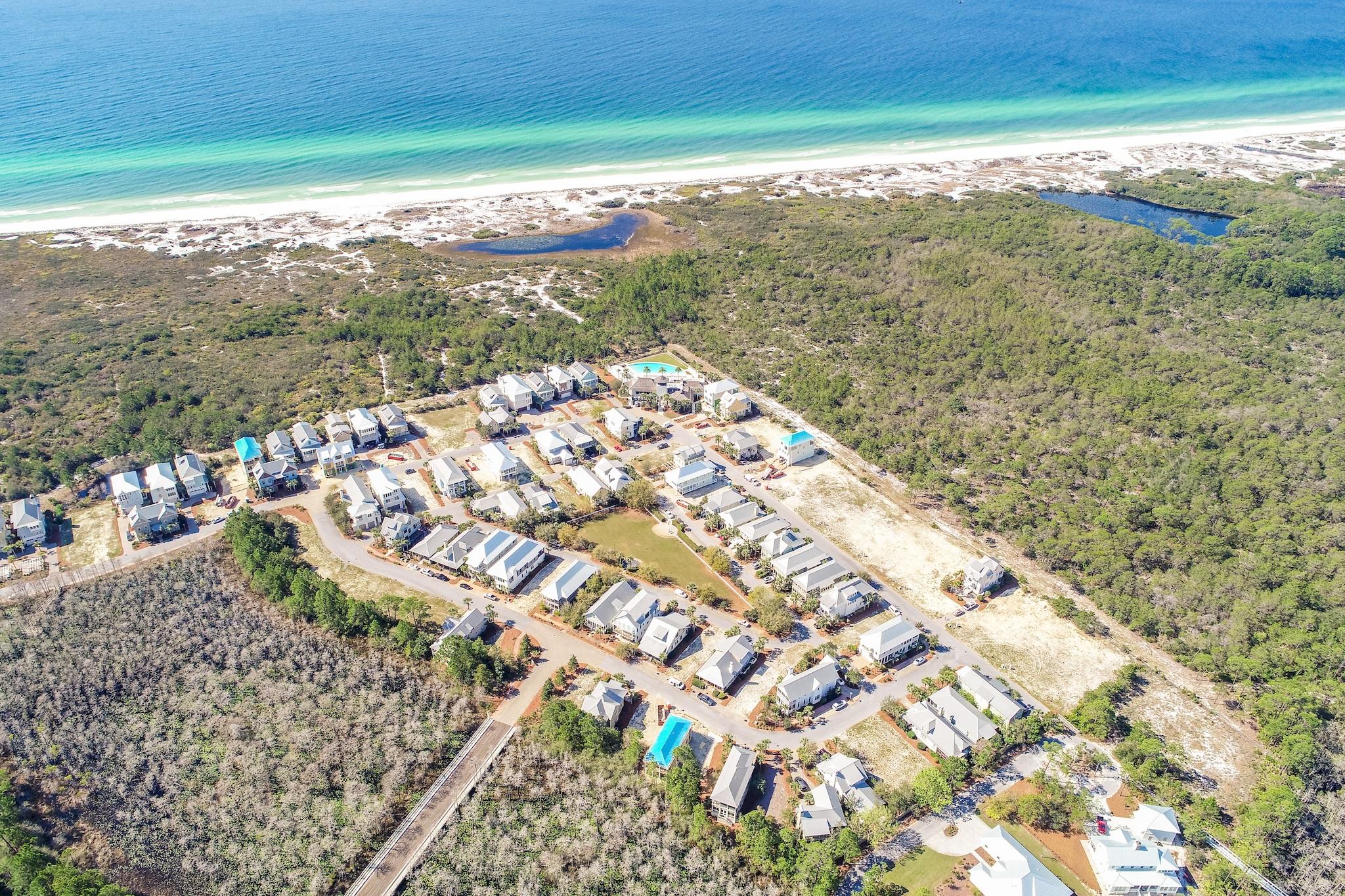 Security and socializing, quality and community are hallmarks of the gated Cypress Dunes neighborhood. It's the place of the year to bring your beach dream home ideas and work with the all-star team at John Willis Homes, known for superior craftsmanship and complete design-build services. The classic Florida college designs feature open space concepts, chef-inspired kitchens, natural wood floors, porches and colors and finishes that you can choose. Covered clubhouse conversation clusters, infinity edge pool overlooking a natural setting to the Gulf, premier fitness center, sunset viewing deck and proximity to the beach without crossing any highway raise the bar on beach living in style. Shopping, dining and water sports nearby add to the temptation to build in Cypress Dunes.