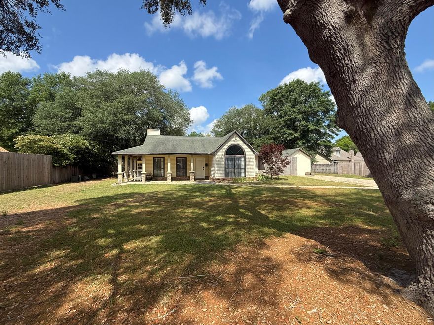 With approx 1/2 acre, this 3 bdrm, 2 bath home is south of Crestview in the county. Completely fenced-in, large back yard with mature live oak trees on a cul-de-sac.  There is a small shed to store lawn tools, a 12 x 24 building that has a window a/c unit that was converted from a 1-car garage. Many upgrades theist fee years include:  roof replaced in 2018, new septic in 2019, HVAC  in 2017 and new vinyl flooring installed in 2018. The master bathroom was updated in 2024 w tile flooring, vanity with granite top & tub insert. Enjoy the wood burning fireplace in the living room during the cool winter evenings.  In the galley kitchen, all stainless steel appliances with a new dishwasher replaced in 2023. Buyer(s) are responsible to personally verify all details for property and dimensions. Any information contained in this listing is believed to be accurate but is not guaranteed.