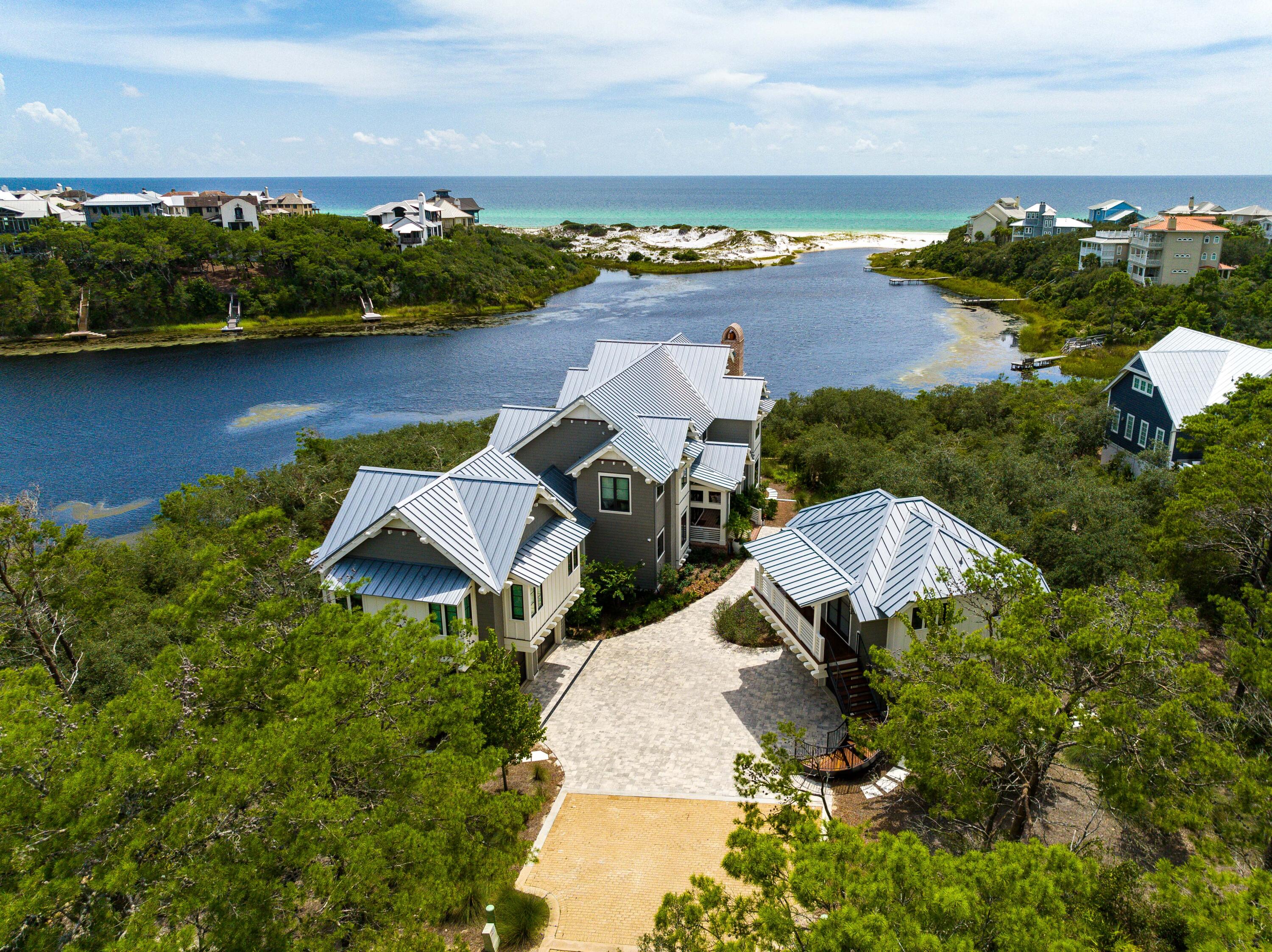 The Majestic Property sits on the Edge of Draper Lake with Expansive Views of the Gulf of MexicoPicturesque vistas abound from this Frank Lloyd Wright inspired masterpiece featuring approximately 135 feet of private lake frontage and majestic views overlooking Draper Lake and the stunning white sand beaches & rolling dune topography of the Gulf of Mexico. This extraordinary residence artfully combines contemporary design with classic naturalist architecture indicative of the Adirondacks and juxtaposed the beautiful ever-changing backdrop of a coastal dune lake.Positioned at the southernmost point of the gated neighborhood, 58 Sinclair Lane is perched at one of the highest elevations on 30A occupying an oversized .274 acre parcel.