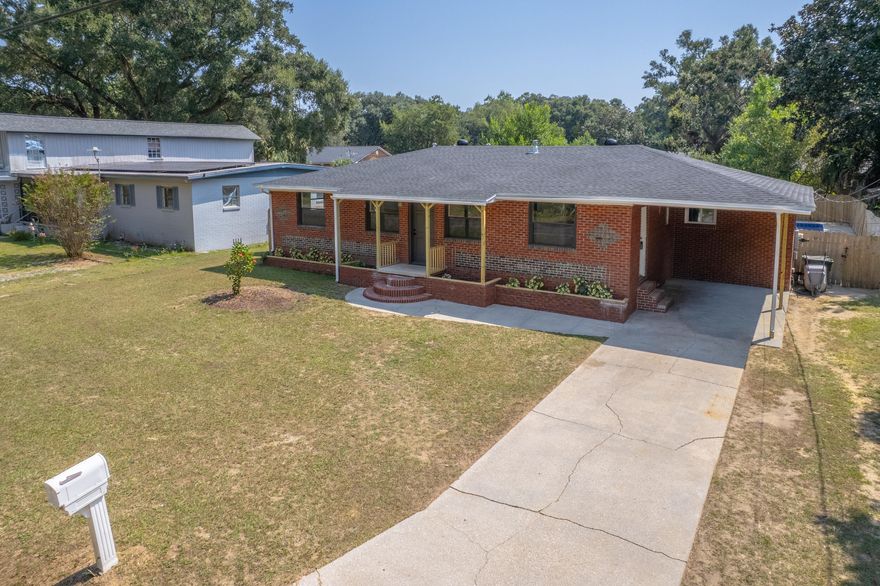 Welcome to this beautifully updated pool home that combines historic charm with modern comfort! Built in 1958, this property offers upgrades galore including a new roof (2025), new HVAC (2025), and a fenced pool with a brand-new liner and skimmer motor. See the full features list in the MLS docs.. Inside, the home feels fresh and inviting with wide plank LVP flooring, neutral paint, new baseboards, crown molding, interior doors, and updated windows complete with hurricane shutters. The open living and dining area welcomes you upon entry, creating a bright and functional gathering space. The primary bedroom is tucked just off the living room, sharing a hallway with one additional bedroom, and features a newly built en-suite bathroom. Off the dining area, the kitchen has been fully redone w ith brand-new GE stainless steel appliances, a gas range, butcher block countertops, new cabinetry, and a modern sink. Just beyond, a large bonus room offers versatile living optionswhether you need a second family room, home office, or flex space. From there, two more bedrooms and a full bathroom provide convenience for family or guests. All bathrooms have been refreshed with new vanities, sinks, and toilets, ensuring move in ready ease. Step outside to enjoy the fenced pool and a spacious backyard! Perfect for gardening, entertaining, or simply relaxing, the backyard provides space for all activities. Centrally located in Pensacola just off Cervantes, this home is near Sherwood Elementary, only 9 miles from NAS Pensacola and 6 miles from downtown Palafox. With thoughtful updates throughout and timeless character preserved, this property is truly the best of both worlds!